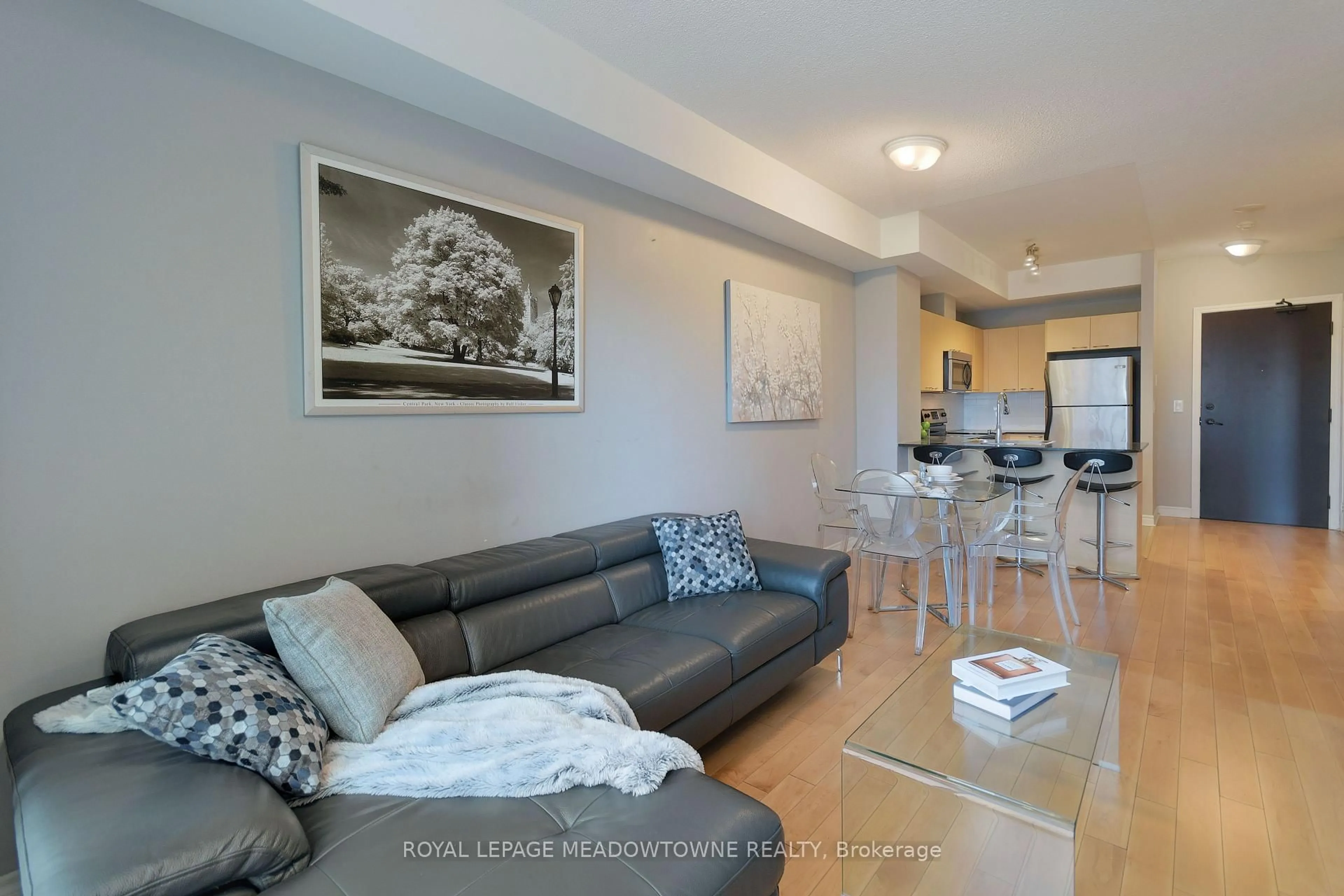 Living room with furniture, wood/laminate floor for 385 Prince Of Wales Dr #307, Mississauga Ontario L5B 0C6