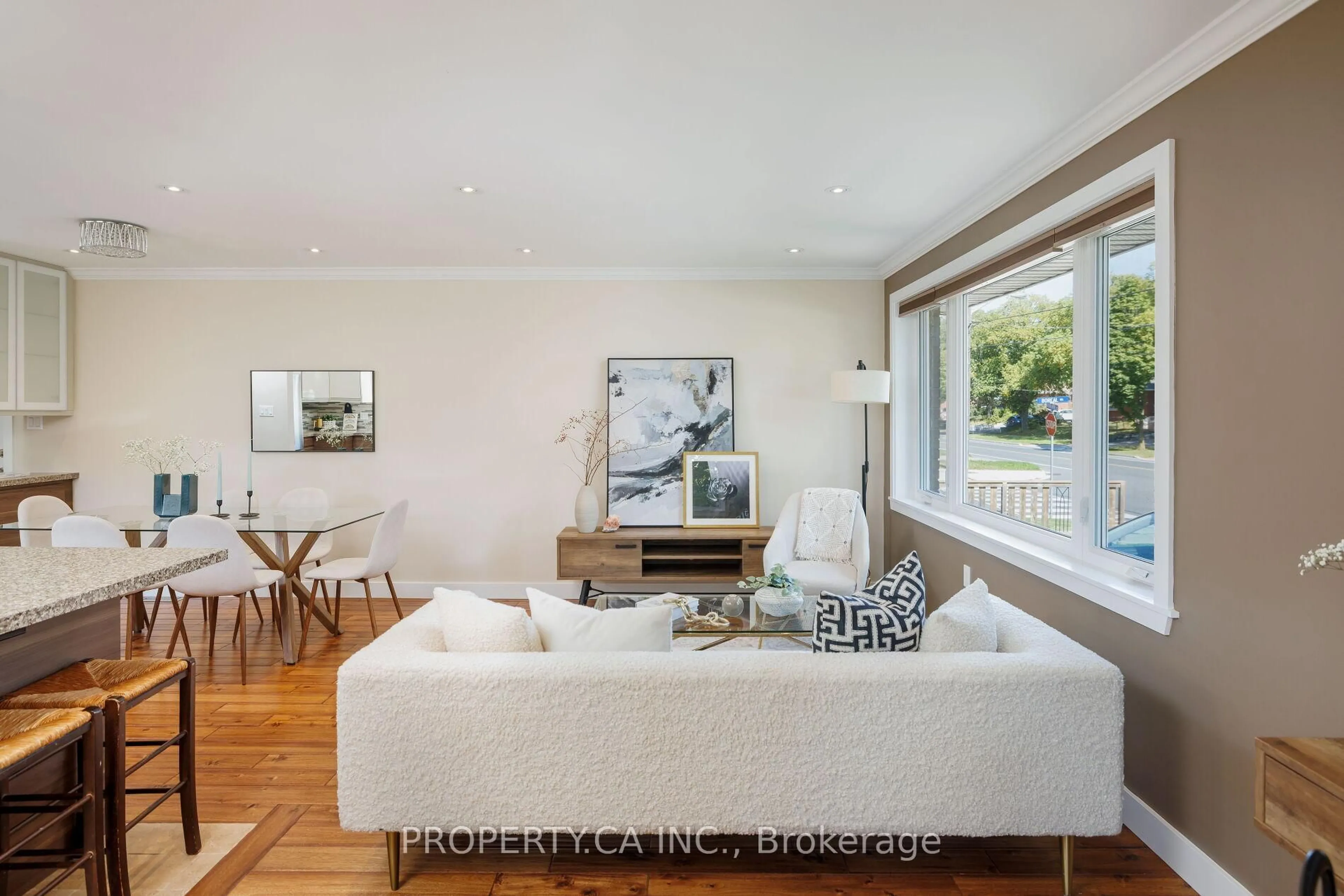 Living room with furniture, wood/laminate floor for 316 Renforth Dr, Toronto Ontario M9C 2L3