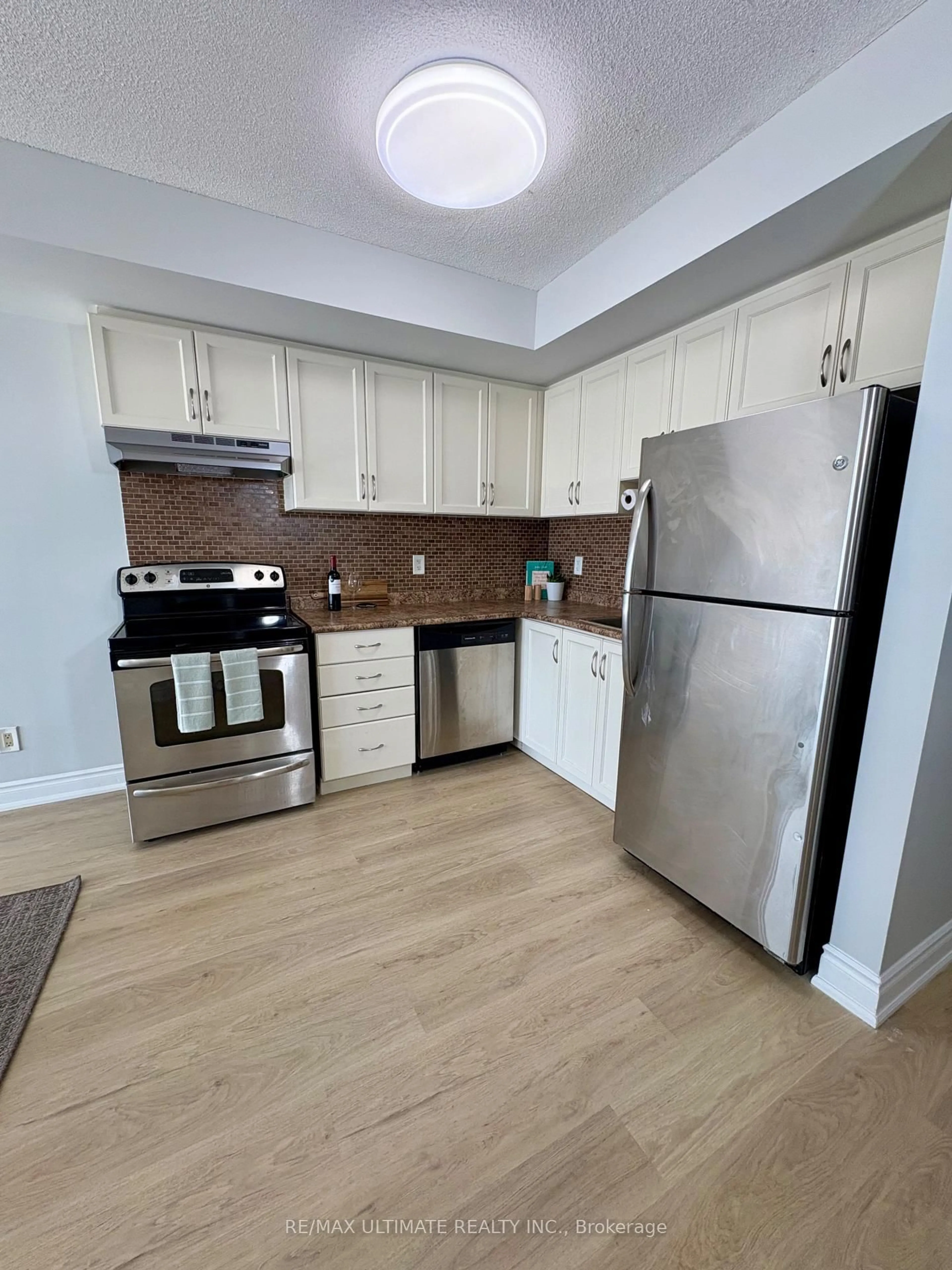 Standard kitchen, wood/laminate floor for 2464 Weston Rd #207, Toronto Ontario M9M 0A2