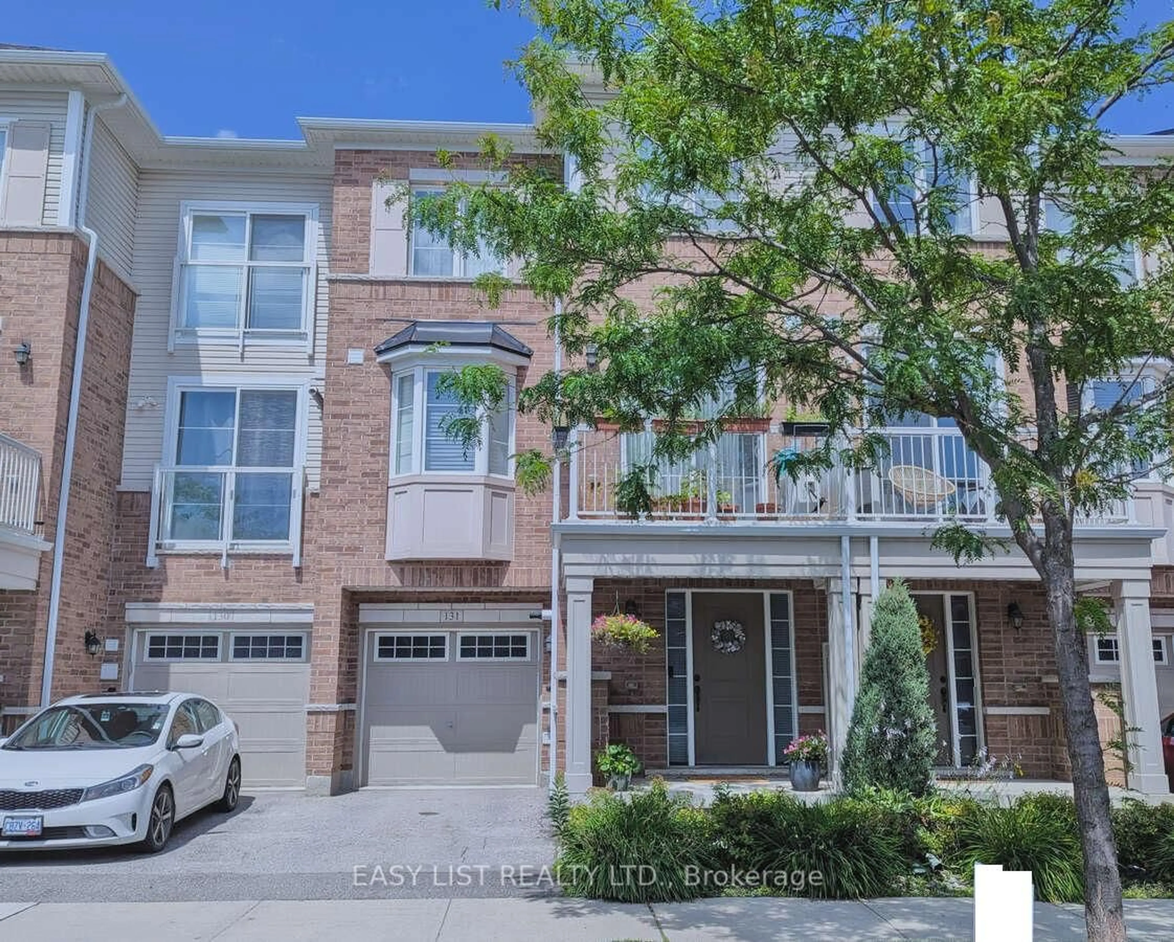 Home with brick exterior material, street for 165 Hampshire Way #131, Milton Ontario L9T 8M7