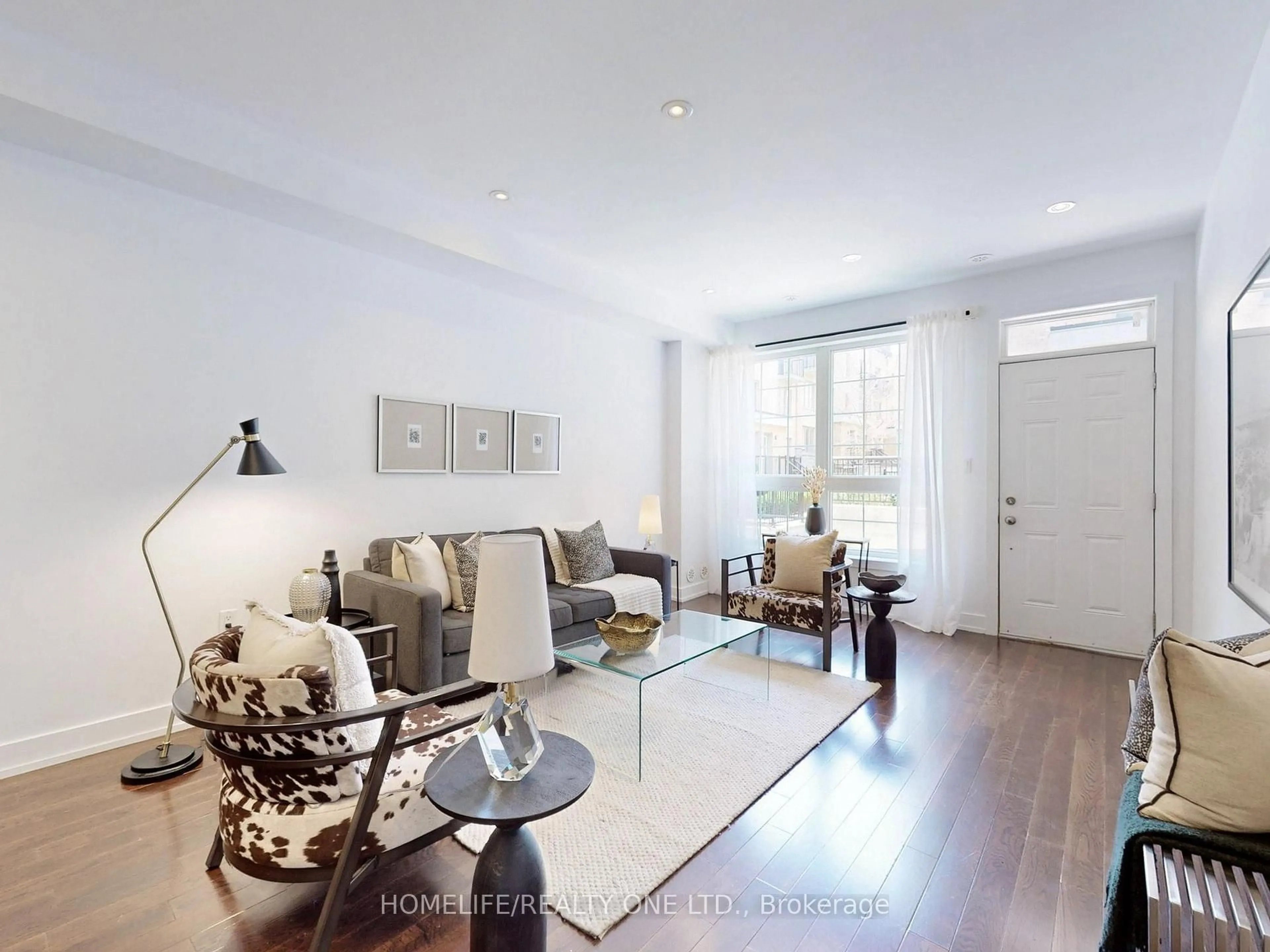 Living room with furniture, wood/laminate floor for 220 Brandon Ave #TH 50, Toronto Ontario M6H 0C5