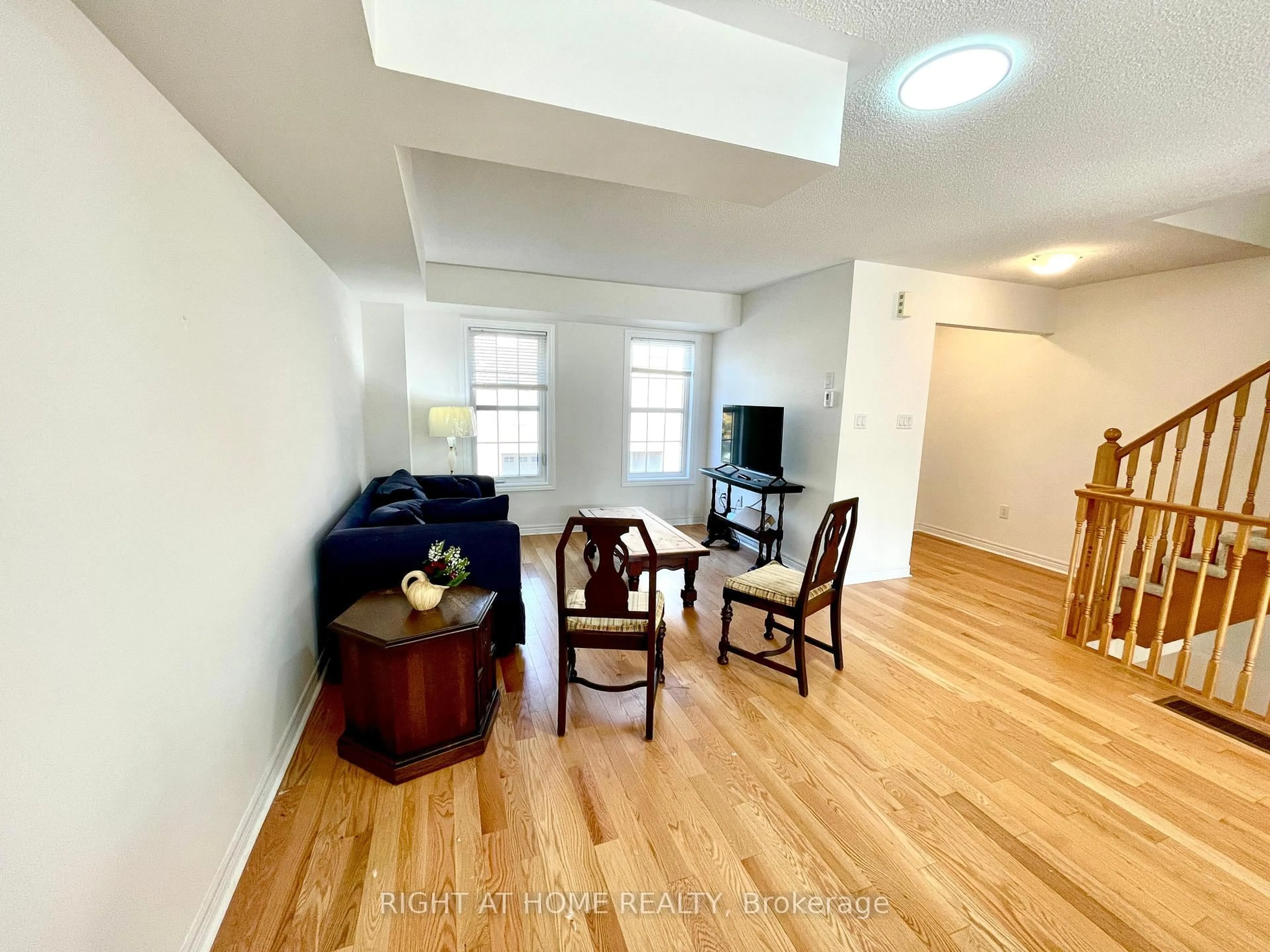 Living room with furniture, wood/laminate floor for 2280 Baronwood Dr #91, Oakville Ontario L6M 0K4