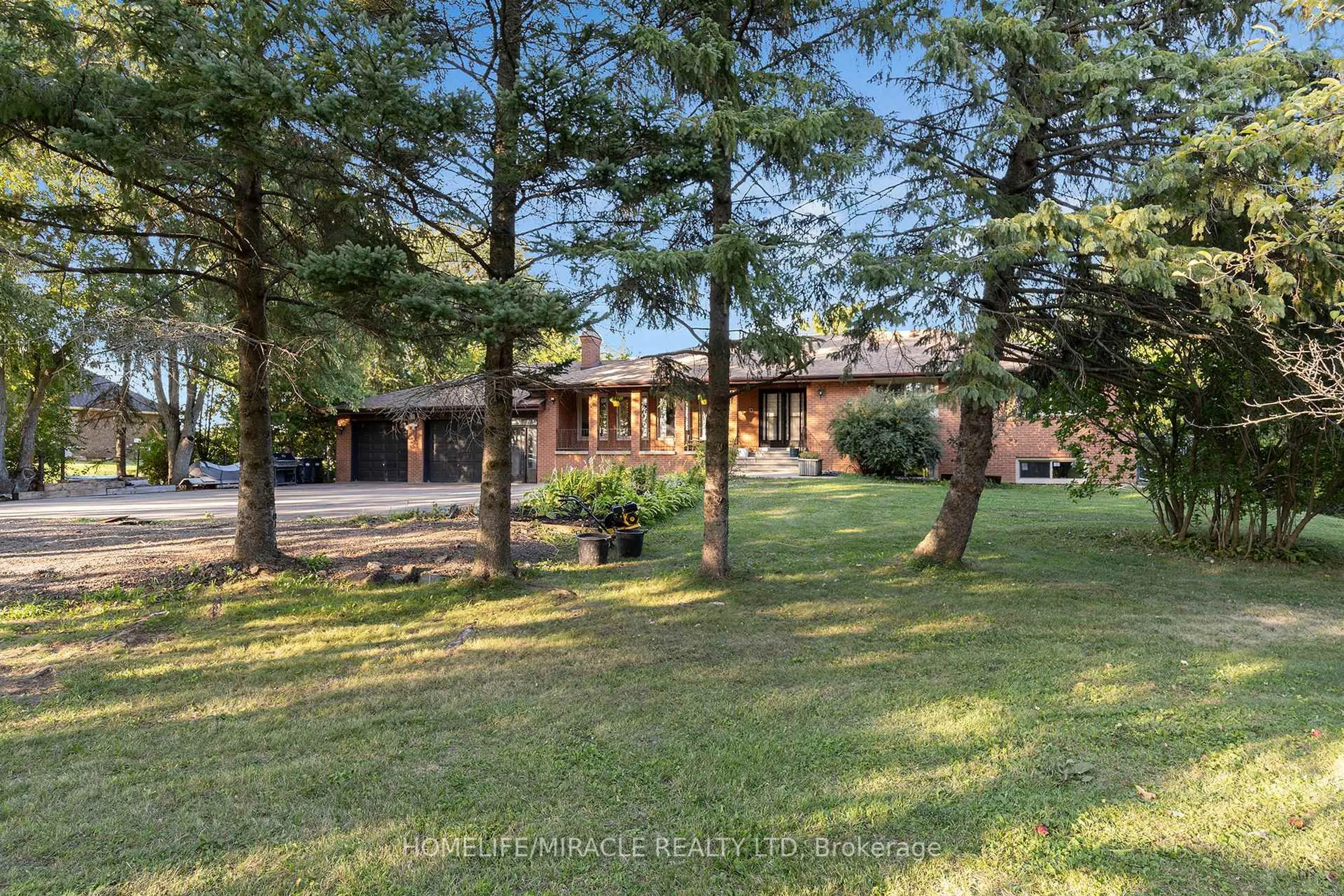 A pic from outside/outdoor area/front of a property/back of a property/a pic from drone, forest/trees view for 14309 BramaleaRd Rd, Caledon Ontario L7C 2P6