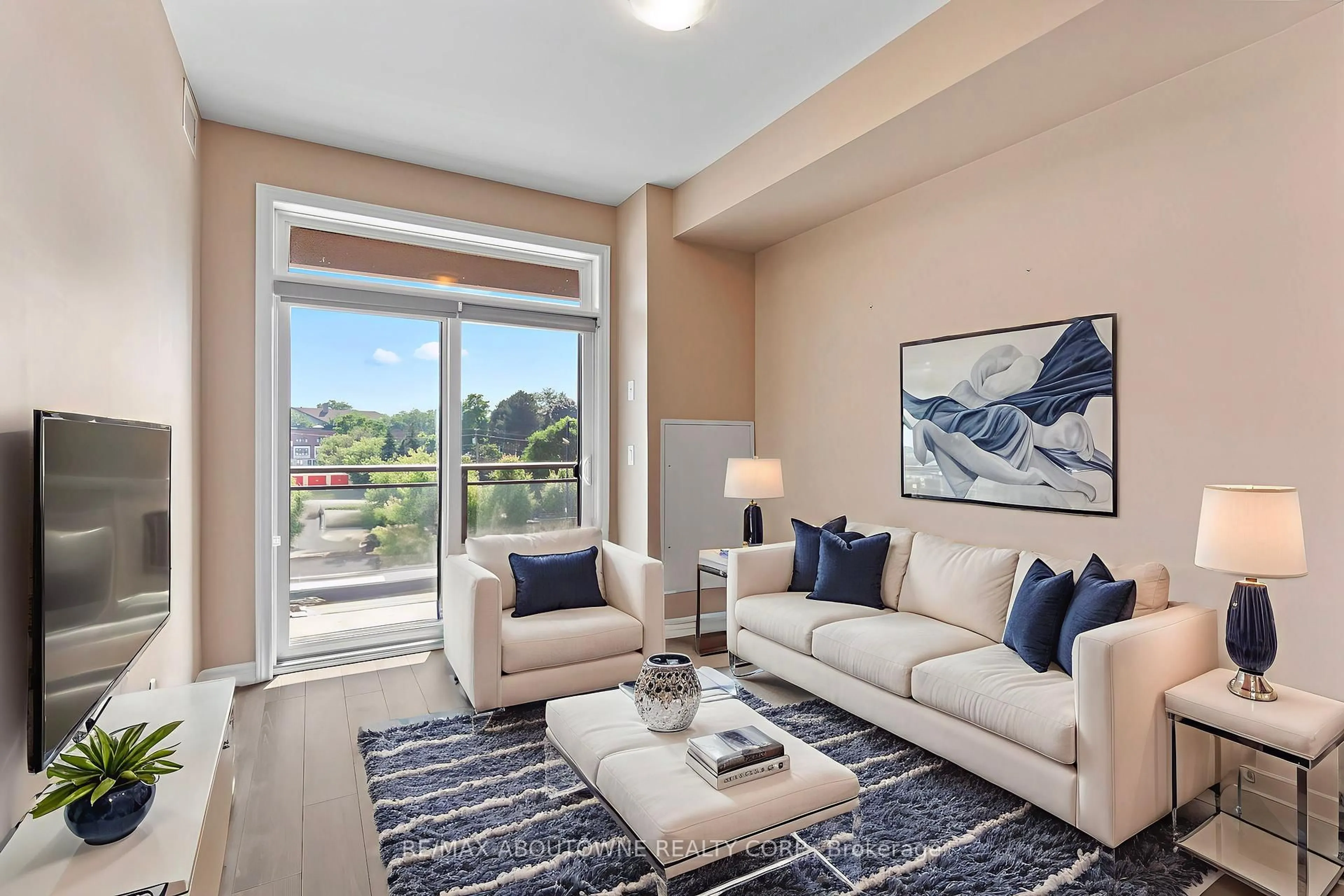 Living room with furniture, unknown for 457 Plains Rd #322, Burlington Ontario L7T 0B8