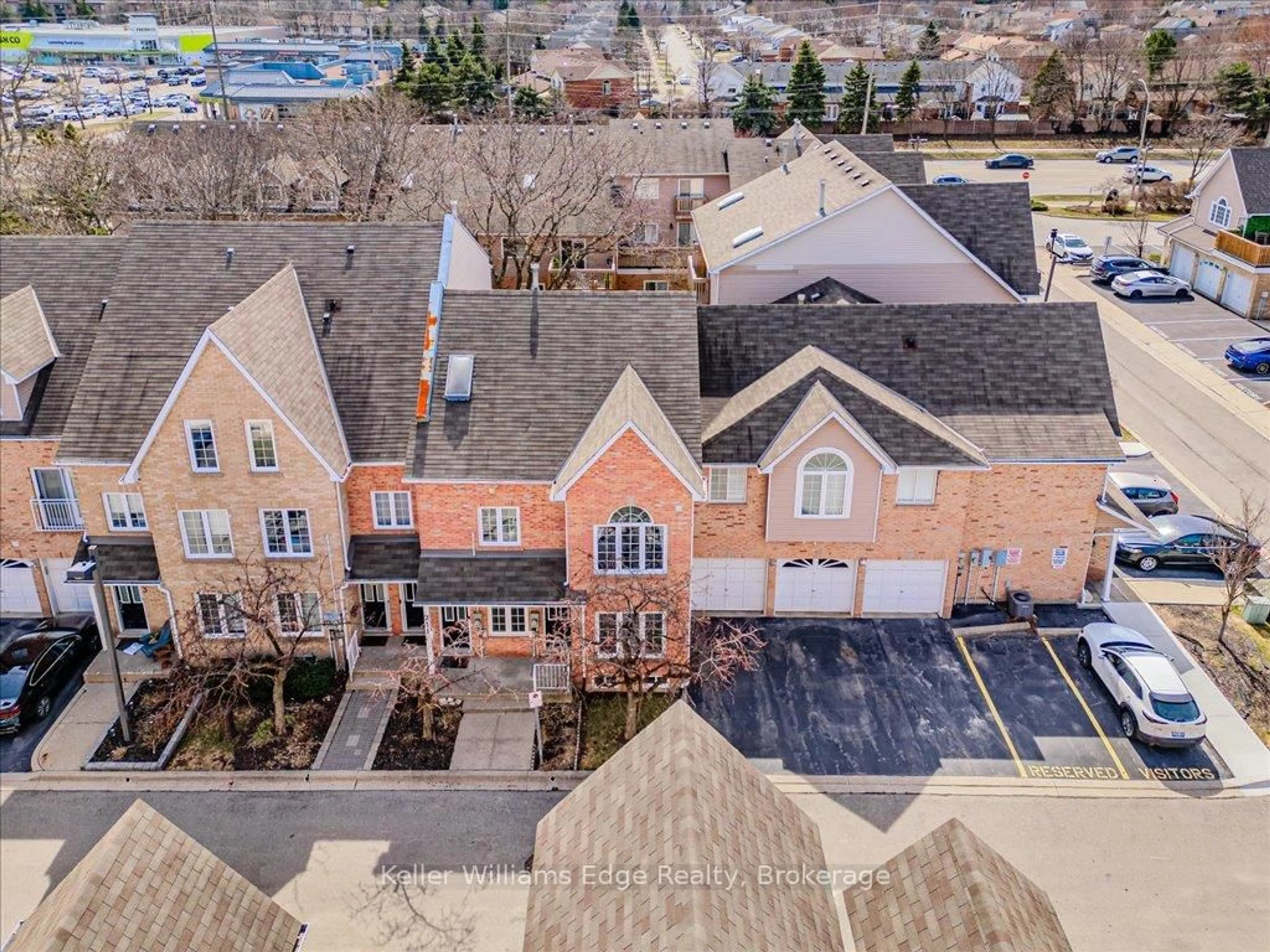 A pic from outside/outdoor area/front of a property/back of a property/a pic from drone, street for 2055 Walkers Line #105, Burlington Ontario L7M 4B5