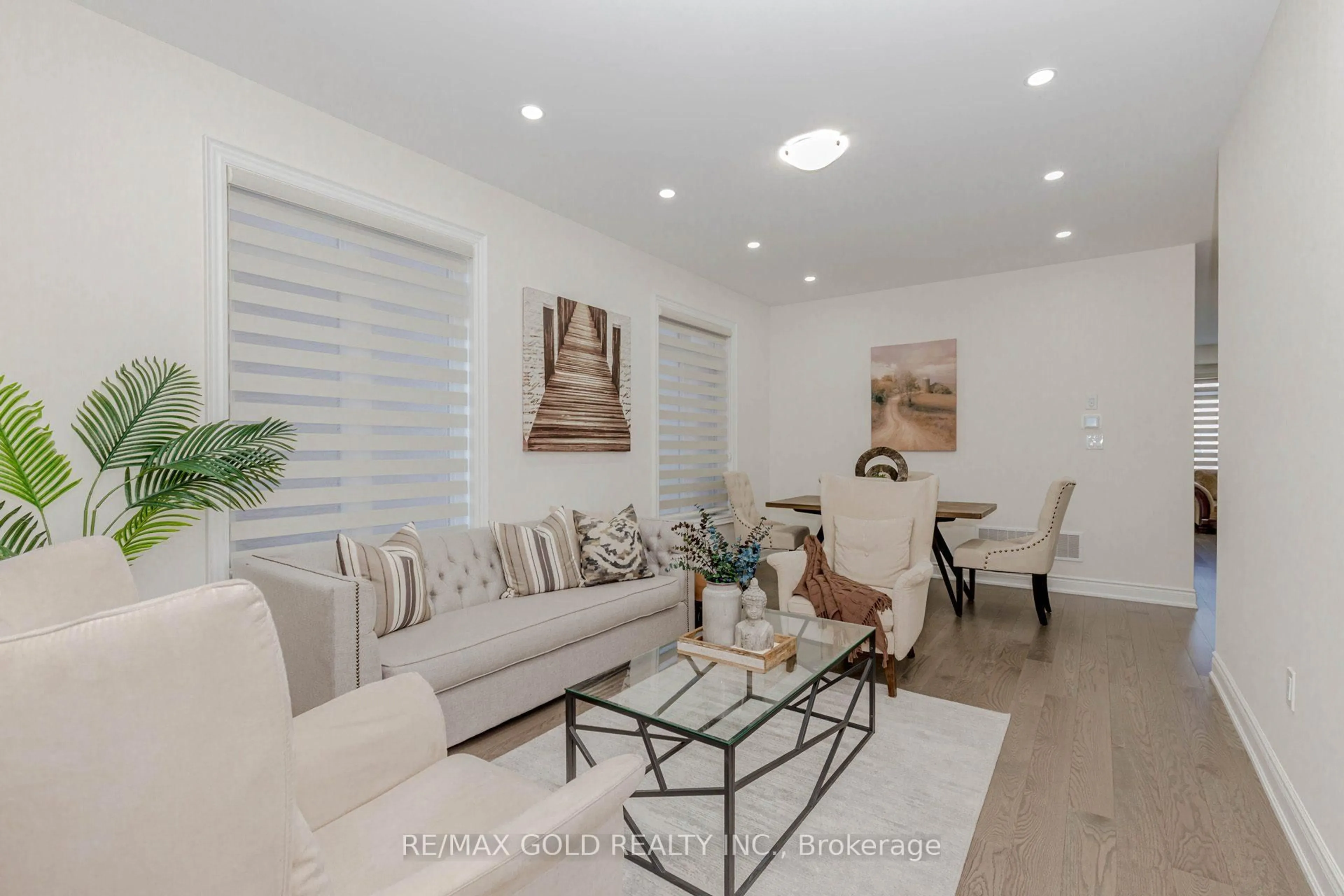 Living room with furniture, wood/laminate floor for 32 Claremount Dr, Brampton Ontario L6R 4G4