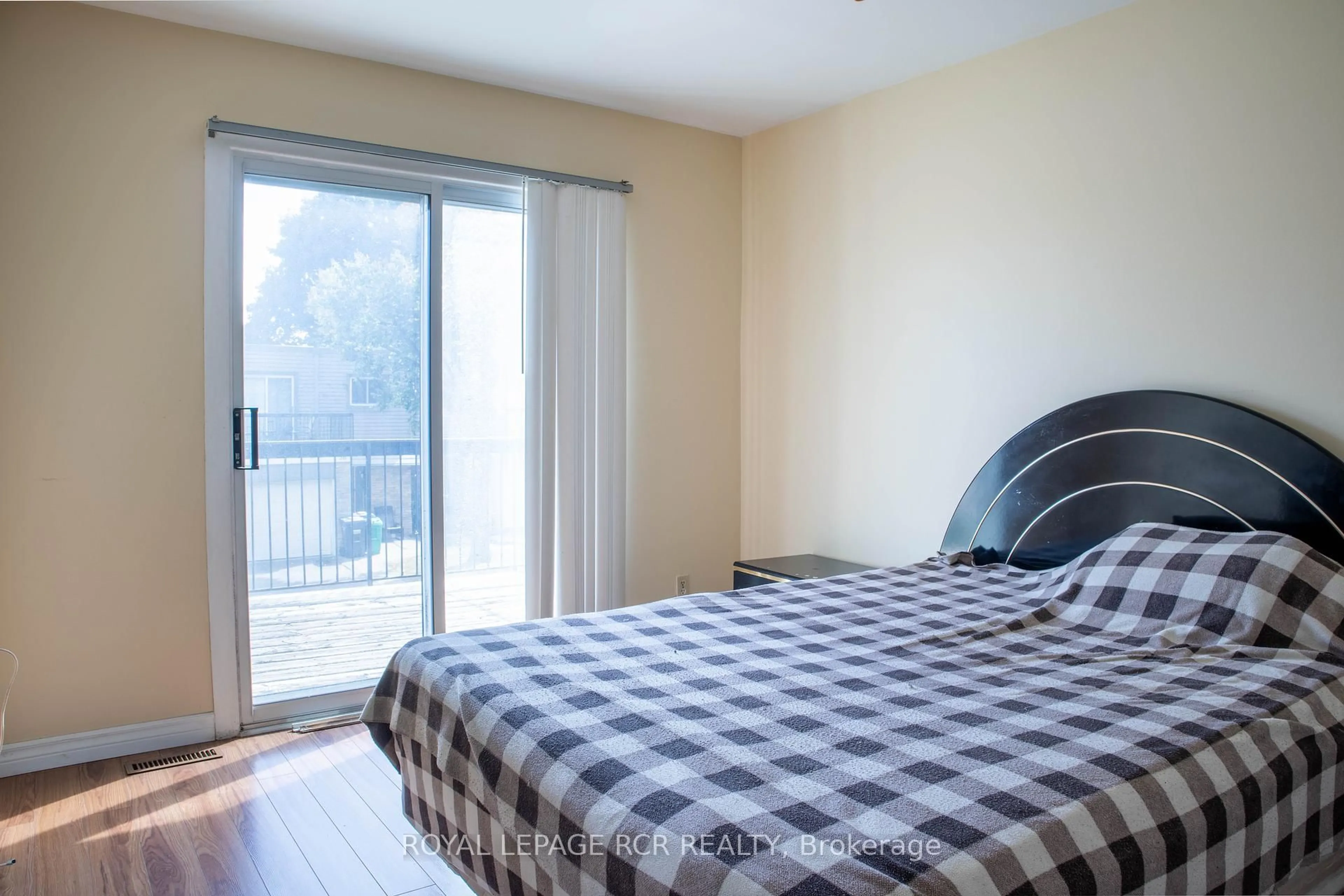 Bedroom with bed, wood/laminate floor for 2315 Bromsgrove Rd #26, Mississauga Ontario L5J 4A6