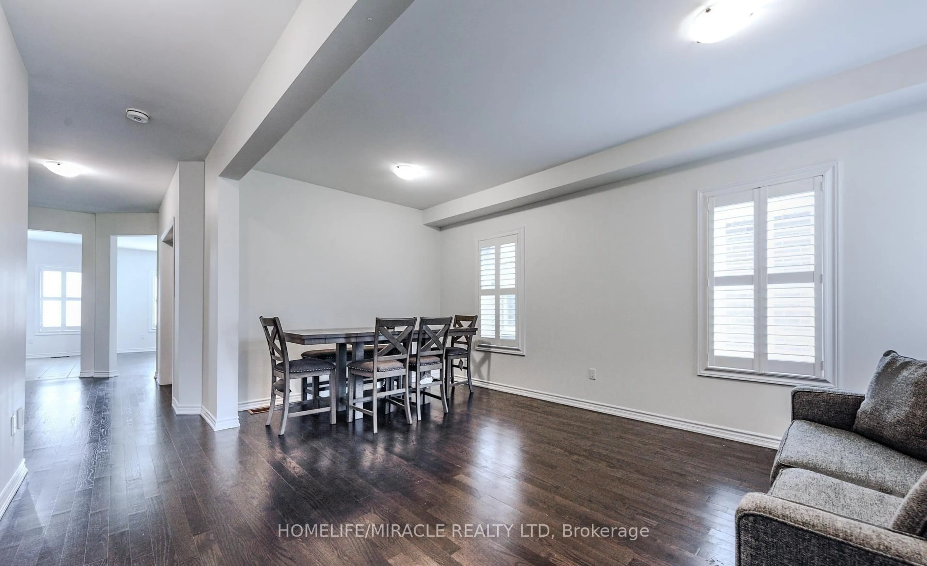 Dining room, wood/laminate floor for 61 Bucksaw St, Brampton Ontario L7A 4P8