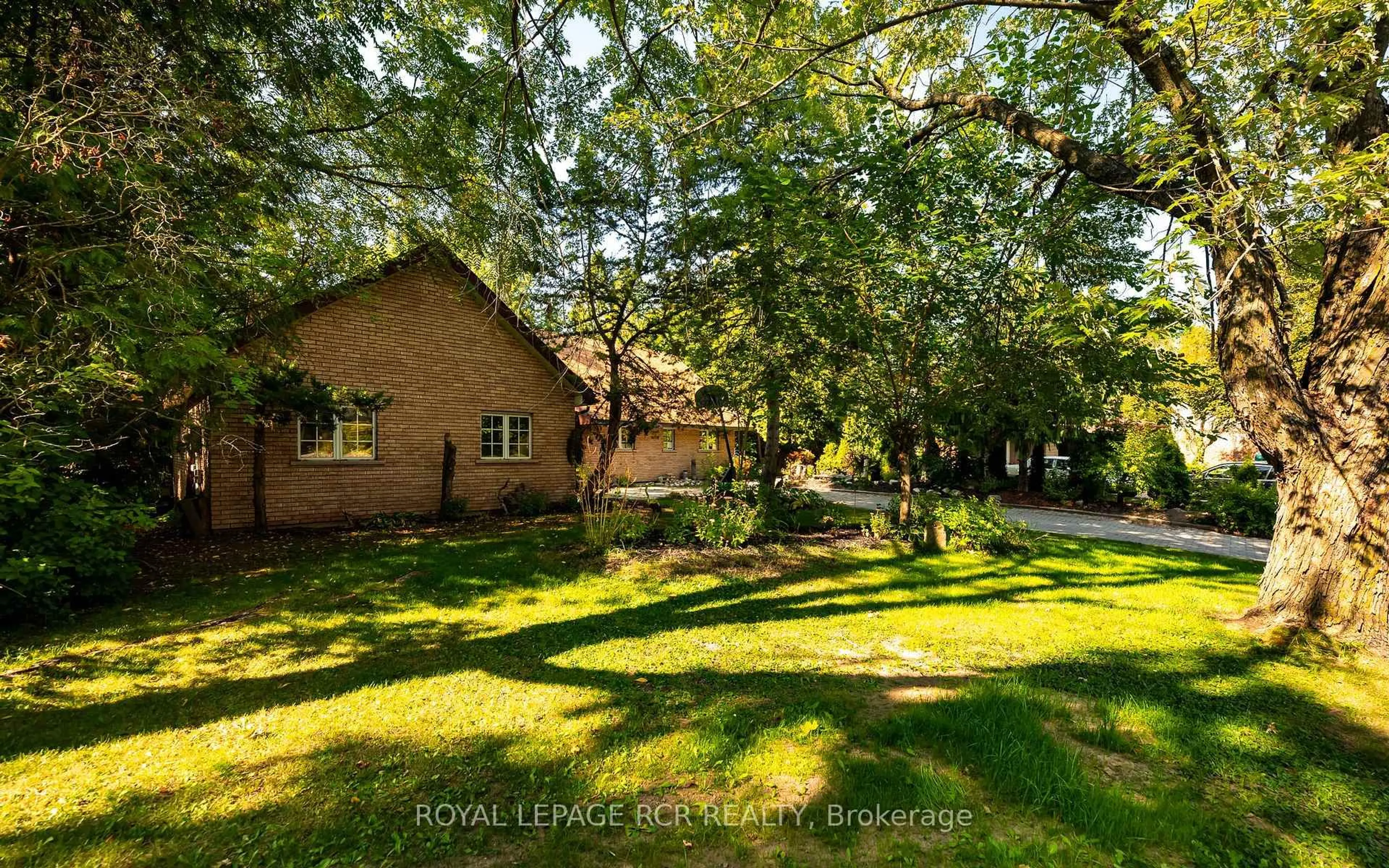 A pic from outside/outdoor area/front of a property/back of a property/a pic from drone, forest/trees view for 33 Forest Park Rd, Orangeville Ontario L9W 1A1