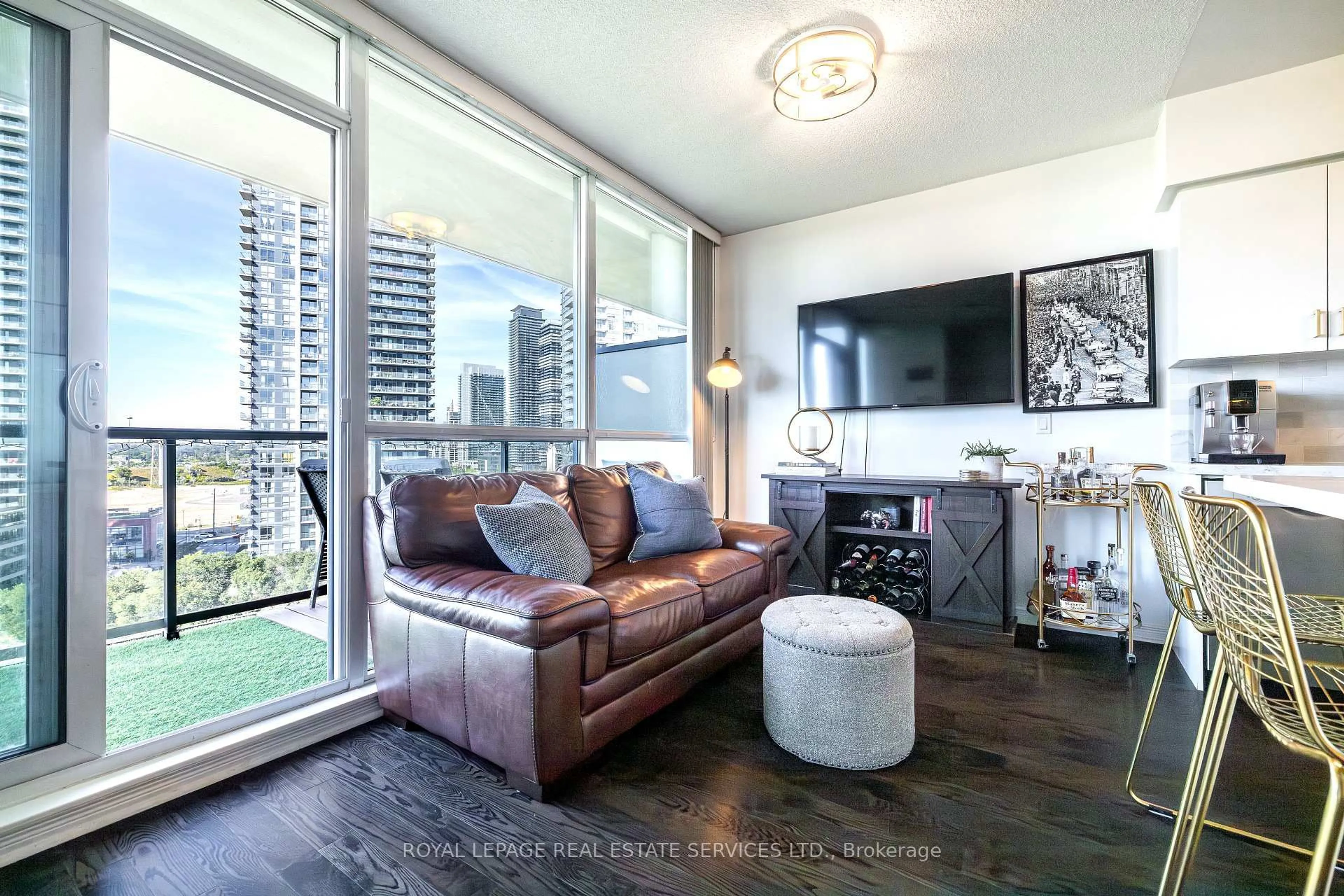 Living room with furniture, wood/laminate floor for 15 Legion Rd #1105, Toronto Ontario M8V 0A9