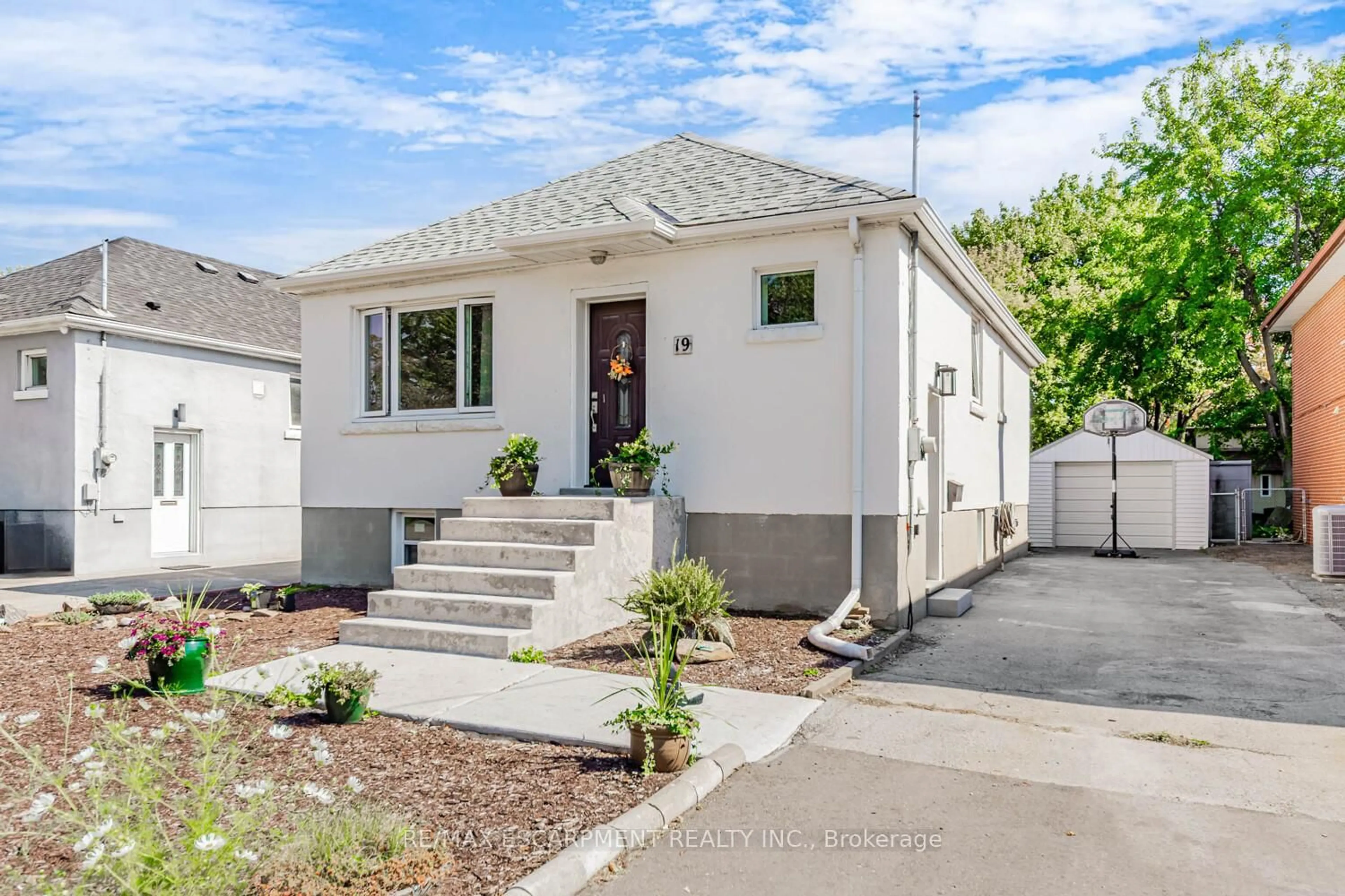 Home with vinyl exterior material, street for 19 Stock Ave, Toronto Ontario M8Z 5C3