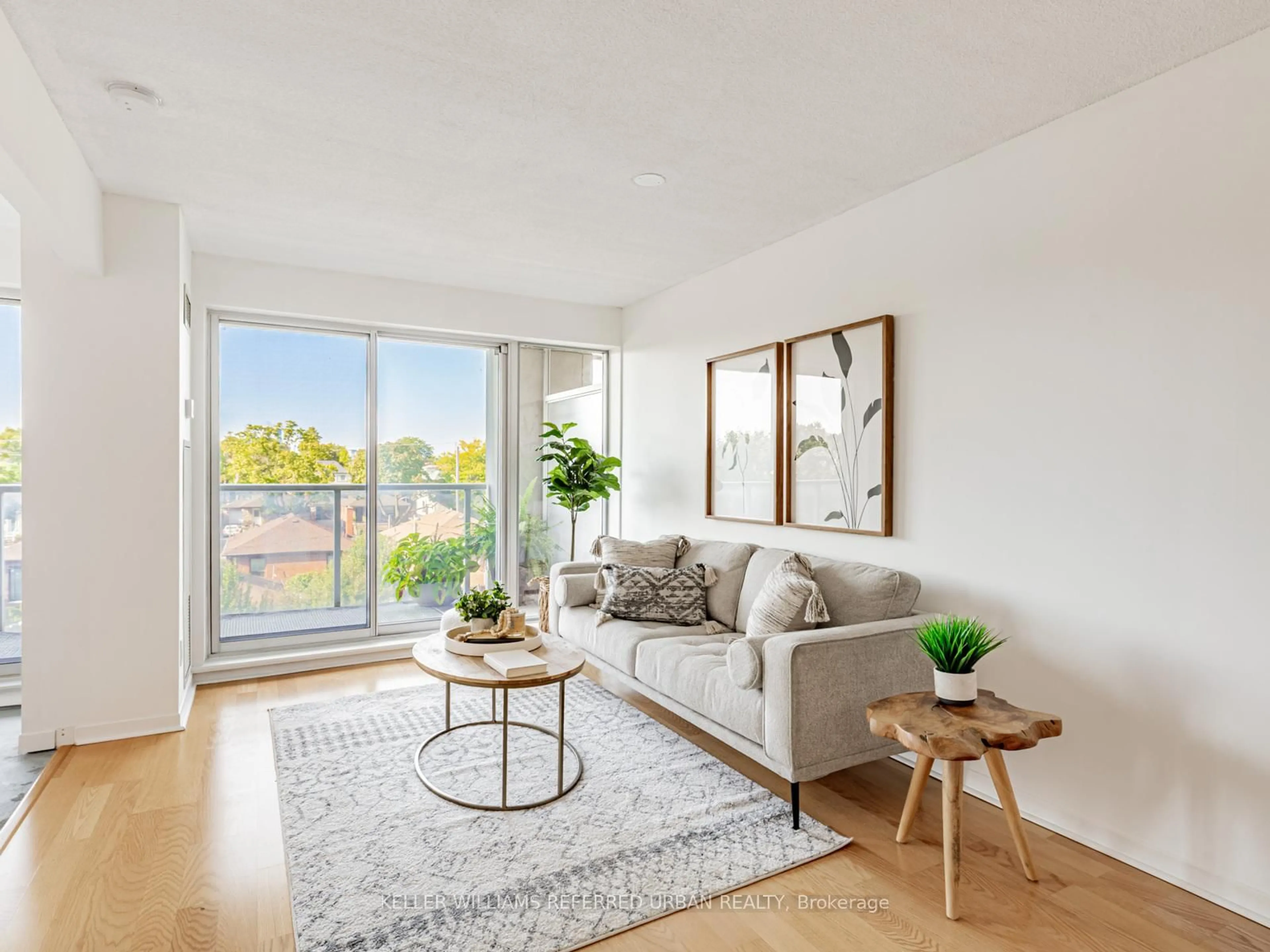 Living room with furniture, wood/laminate floor for 1040 The Queensway #304, Toronto Ontario M8Z 0A7
