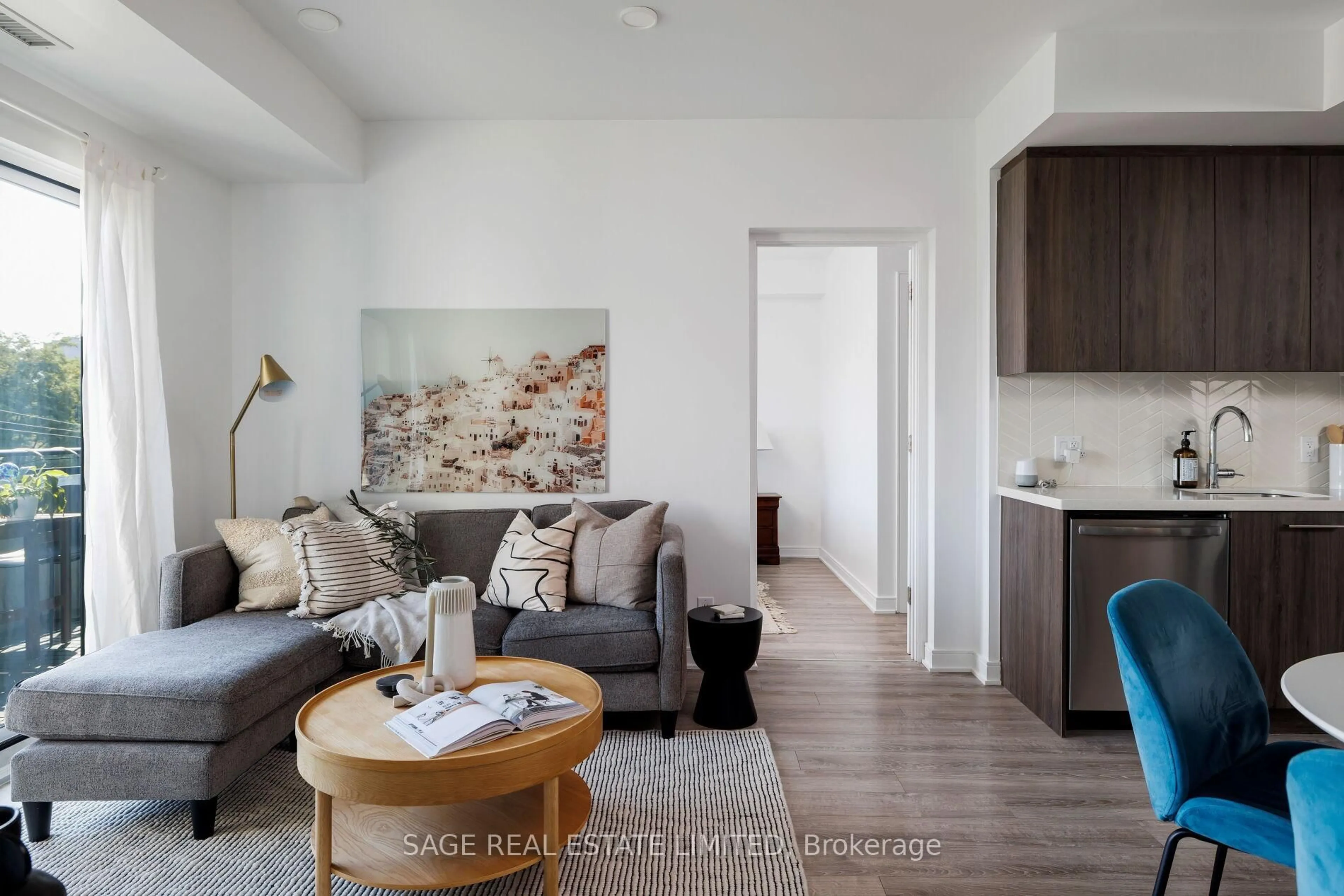 Living room with furniture, wood/laminate floor for 1 Neighbourhood Lane #408, Toronto Ontario M8Y 0C2