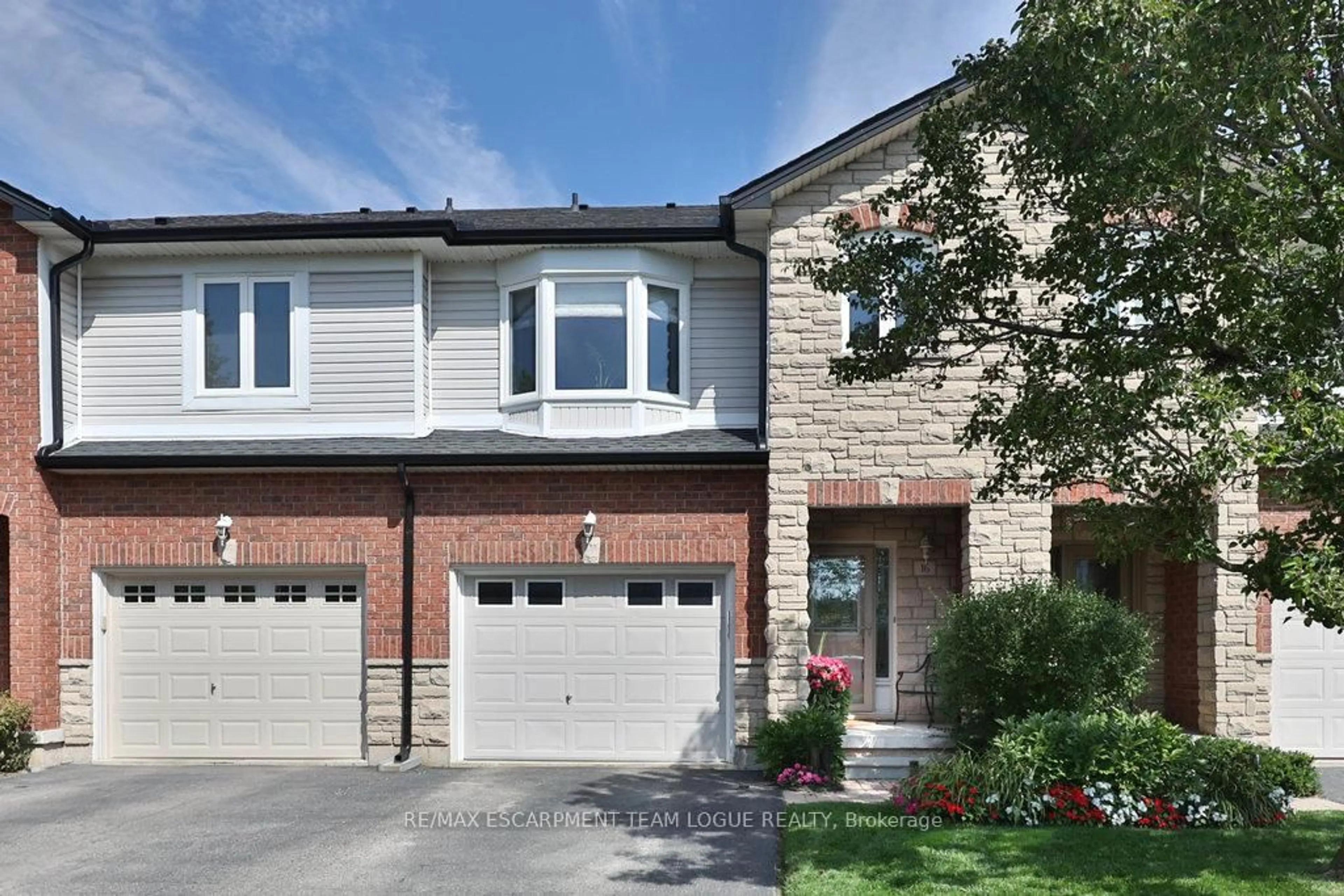 Home with brick exterior material, street for 2229 Walkers Line #16, Burlington Ontario L7M 4X4