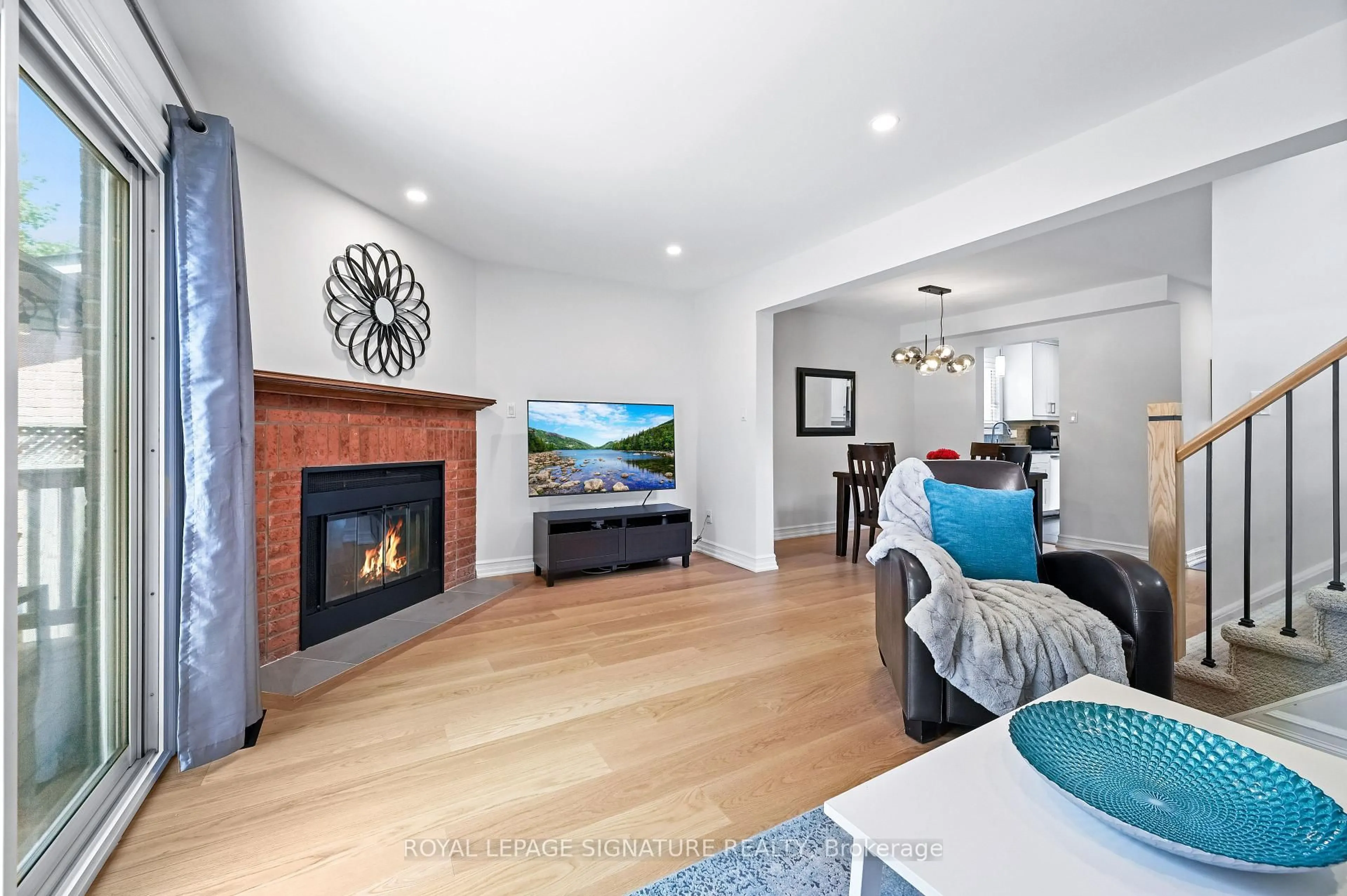 Living room with furniture, wood/laminate floor for 2048 Chrisdon Rd, Burlington Ontario L7M 3W9