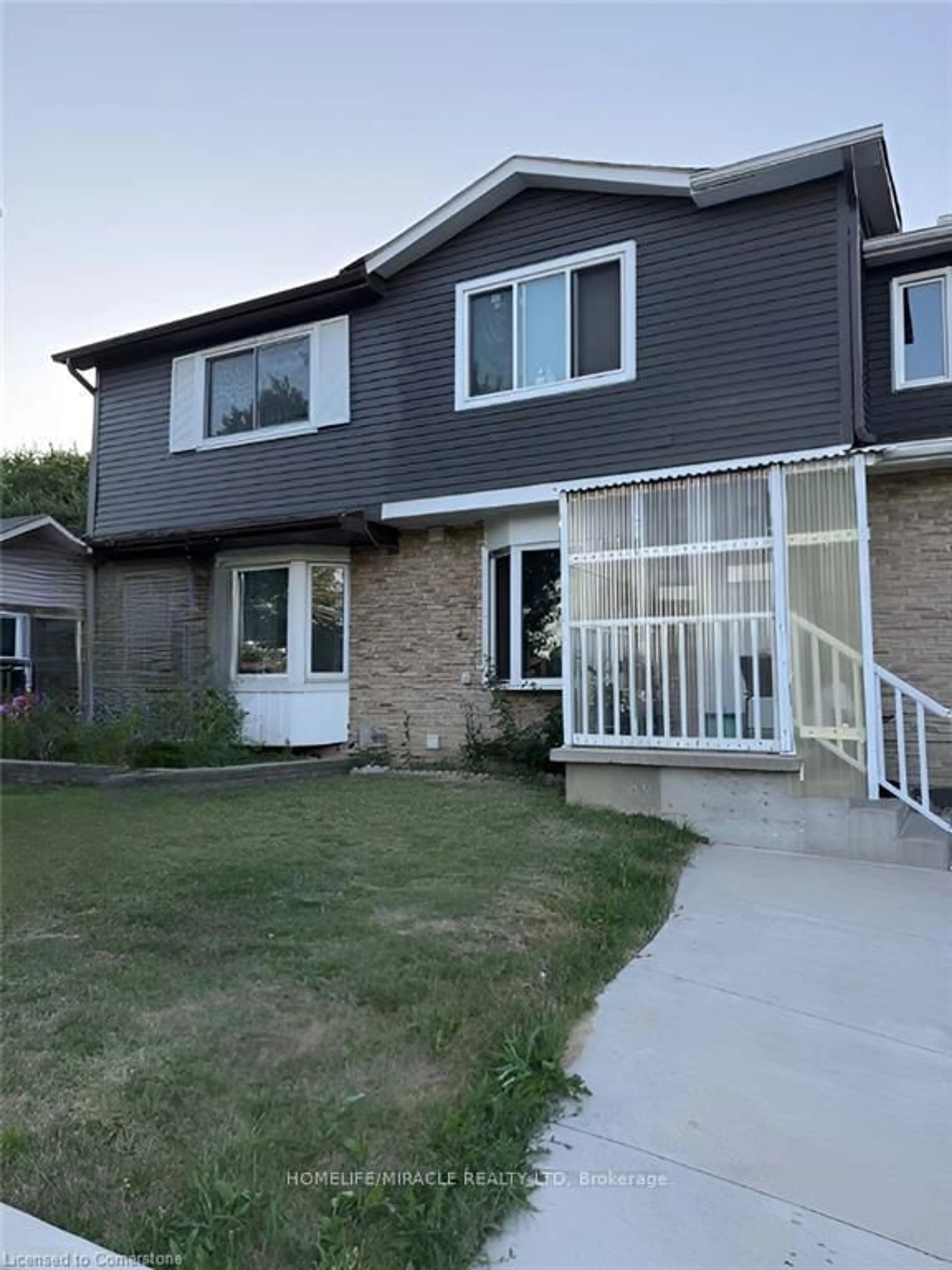 Home with vinyl exterior material, street for 91 Madoc Dr, Brampton Ontario L6V 2A3