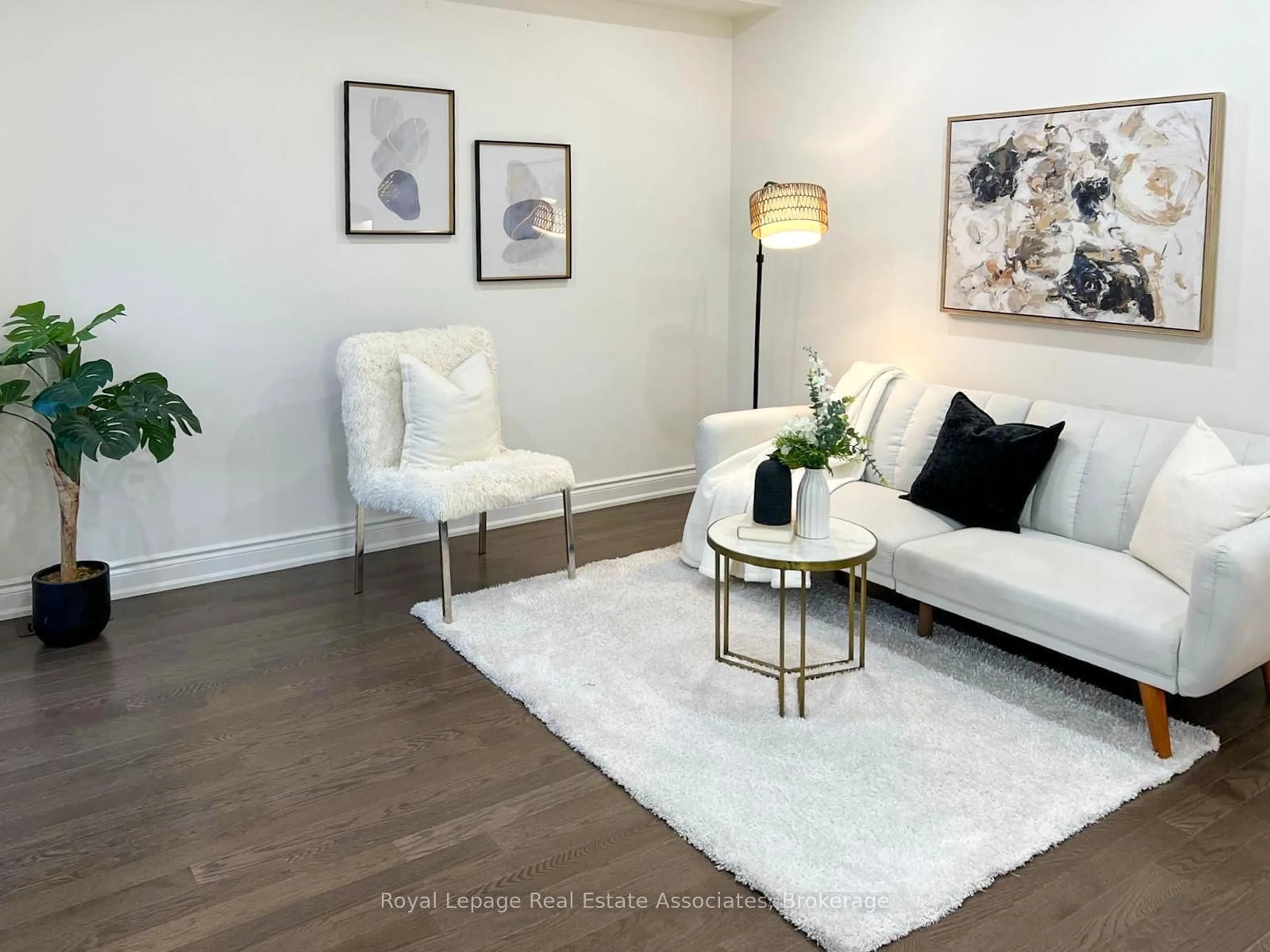 Living room with furniture, wood/laminate floor for 13 Quinton Rdge, Brampton Ontario L6Y 6J4