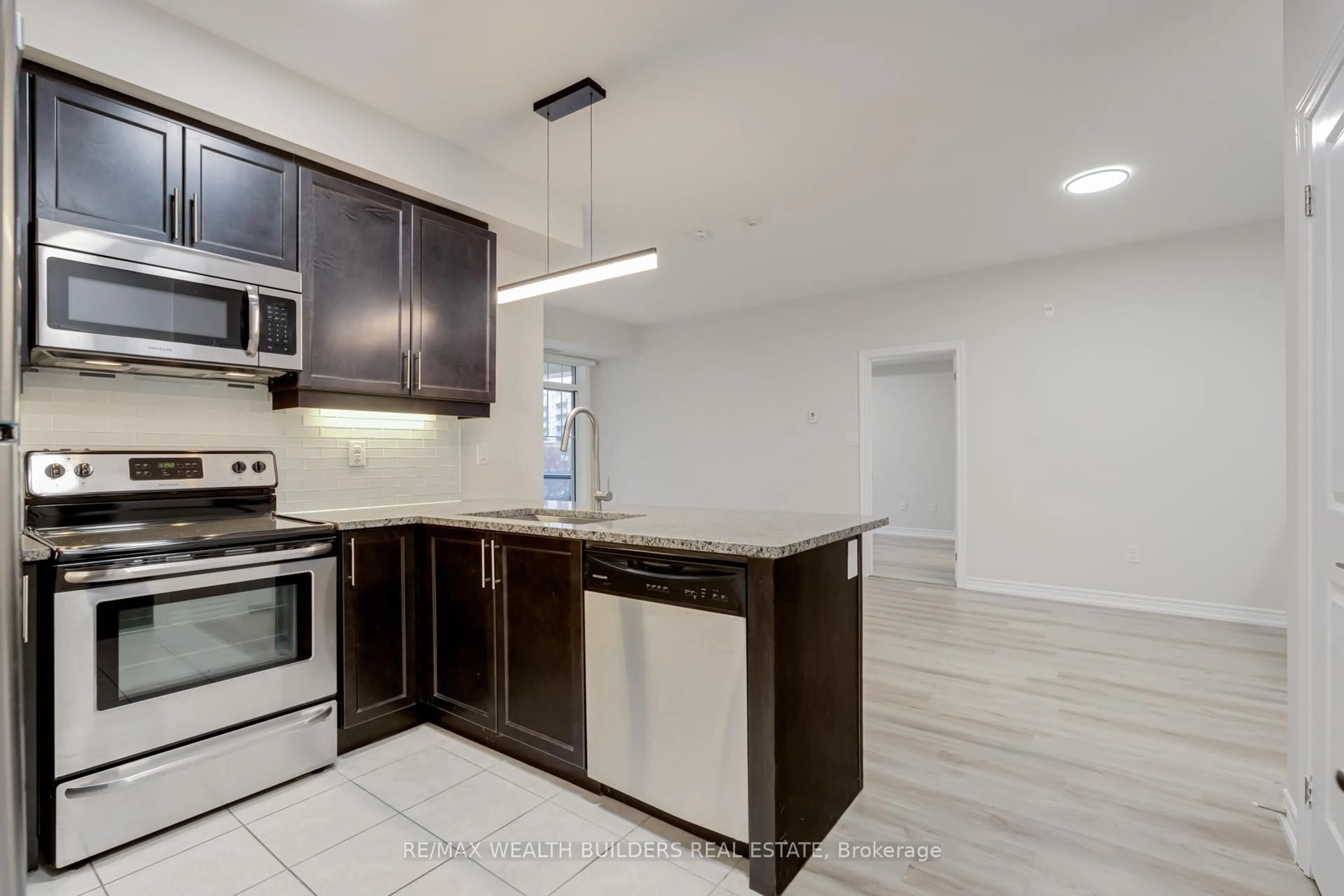 Open concept kitchen, unknown for 2333 Sawgrass Dr #202, Oakville Ontario L6H 0L2