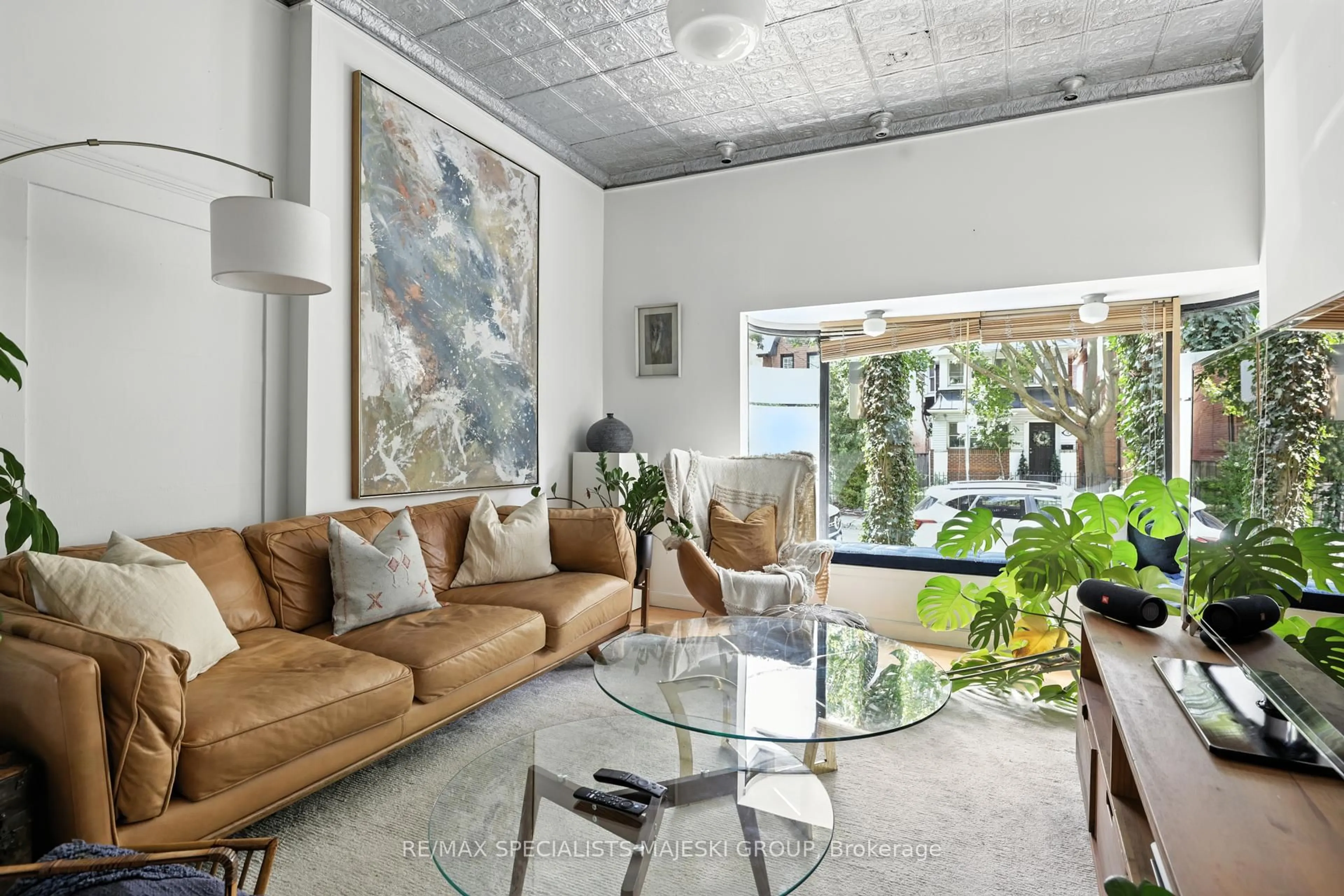 Living room with furniture, cement floor for 69 Elm Grove Ave, Toronto Ontario M6K 2J2