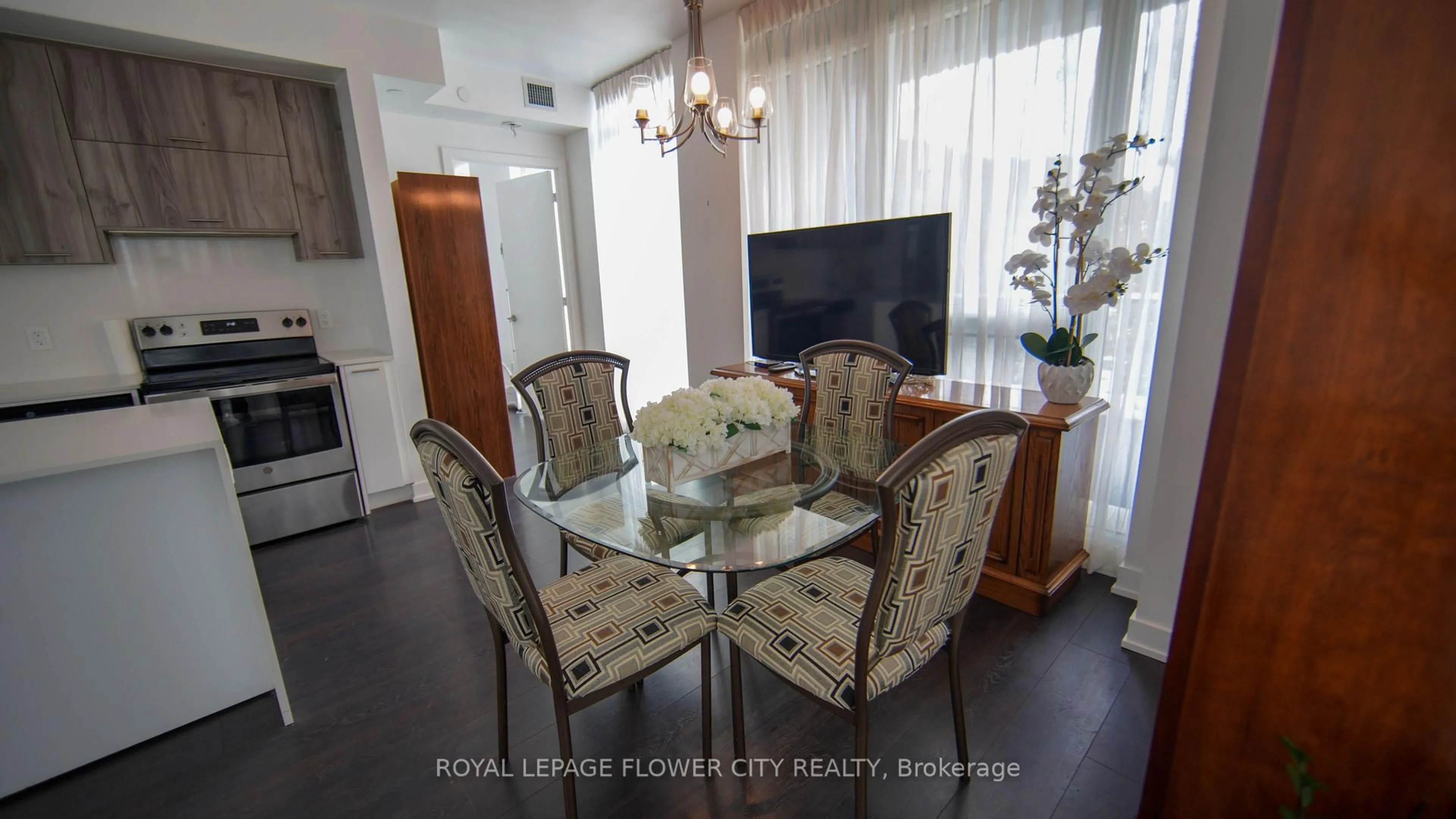 Dining room, wood/laminate floor for 180 Veterans Dr #203, Brampton Ontario L7A 5G7