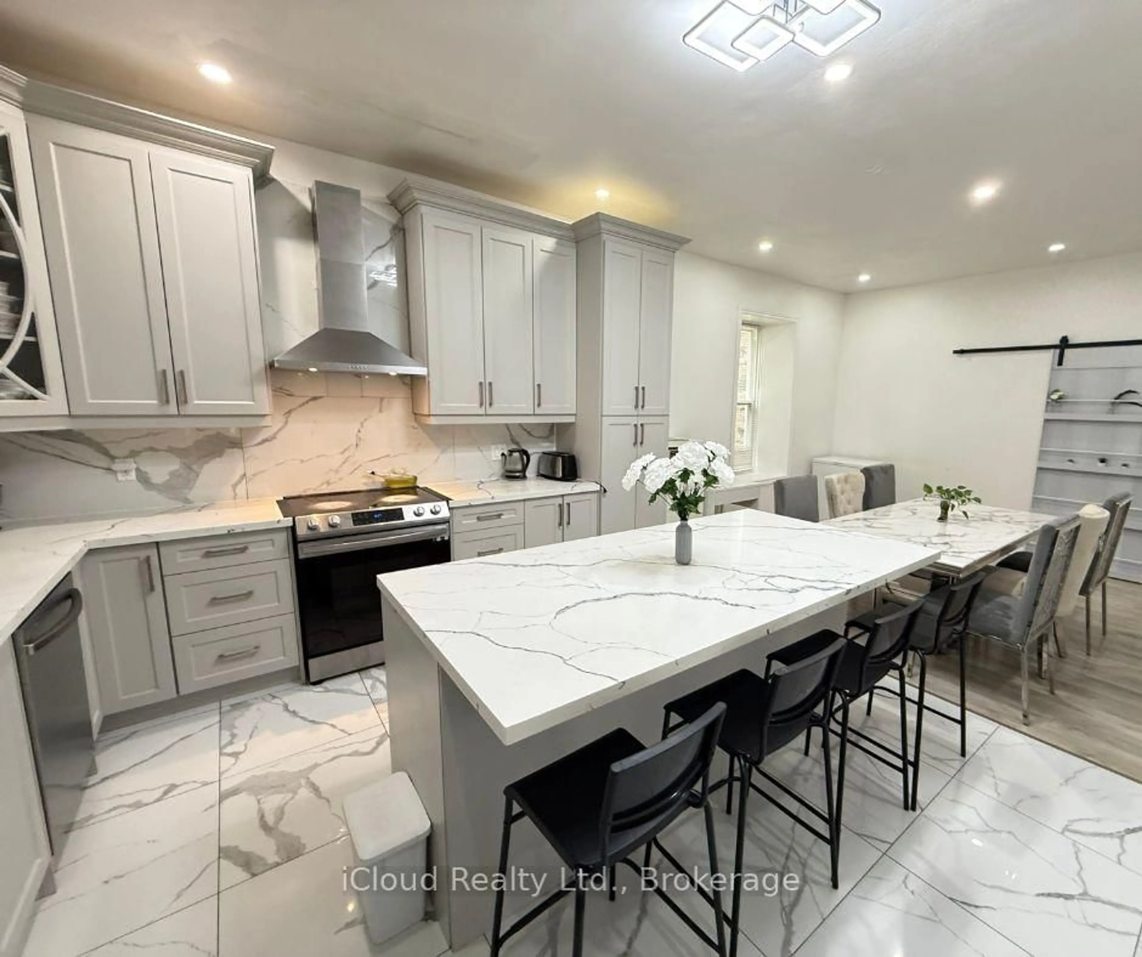 Open concept kitchen, ceramic/tile floor for 7404 Tremaine Rd, Milton Ontario L9E 1A9