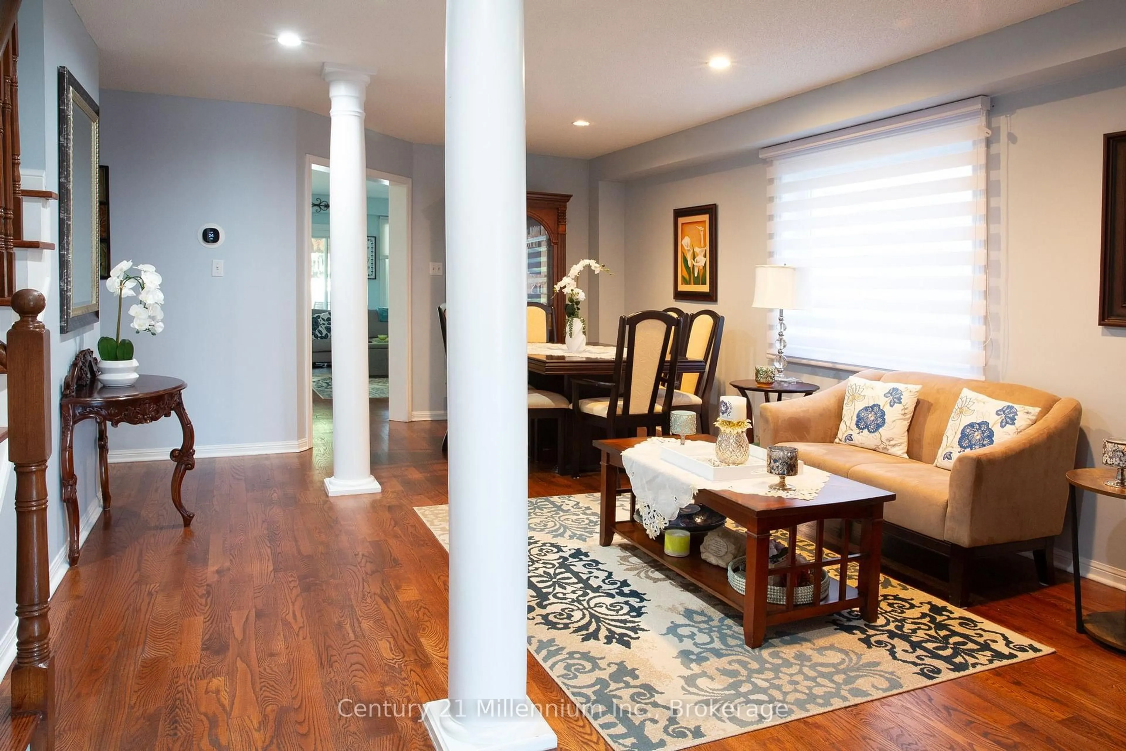 Living room with furniture, wood/laminate floor for 84 Weather Vane Lane, Brampton Ontario L6X 4R4