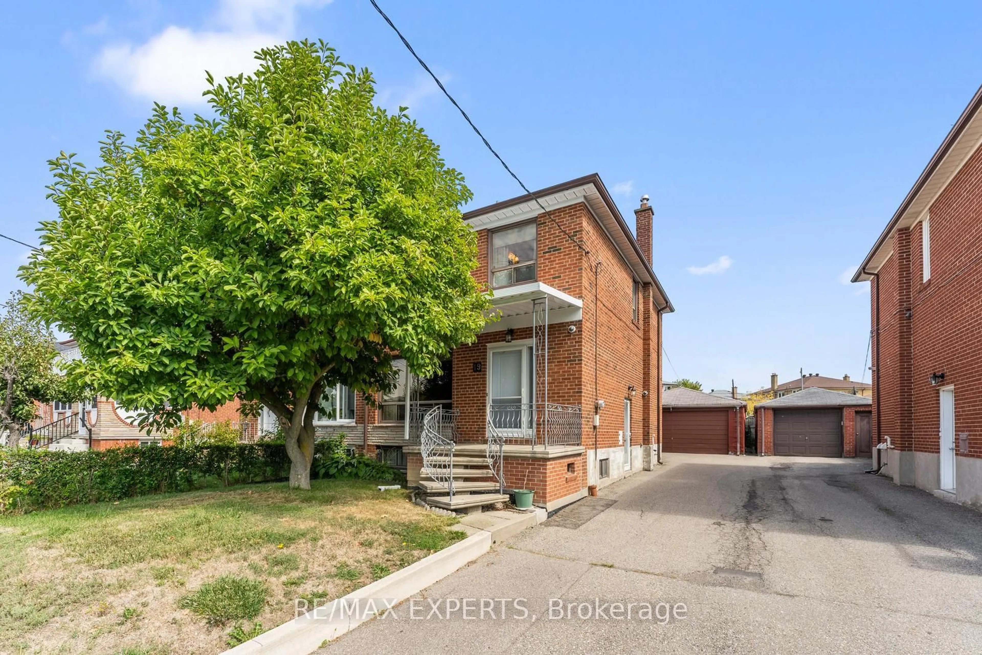 Home with brick exterior material, street for 19 Peterdale Rd, Toronto Ontario M3L 1T8