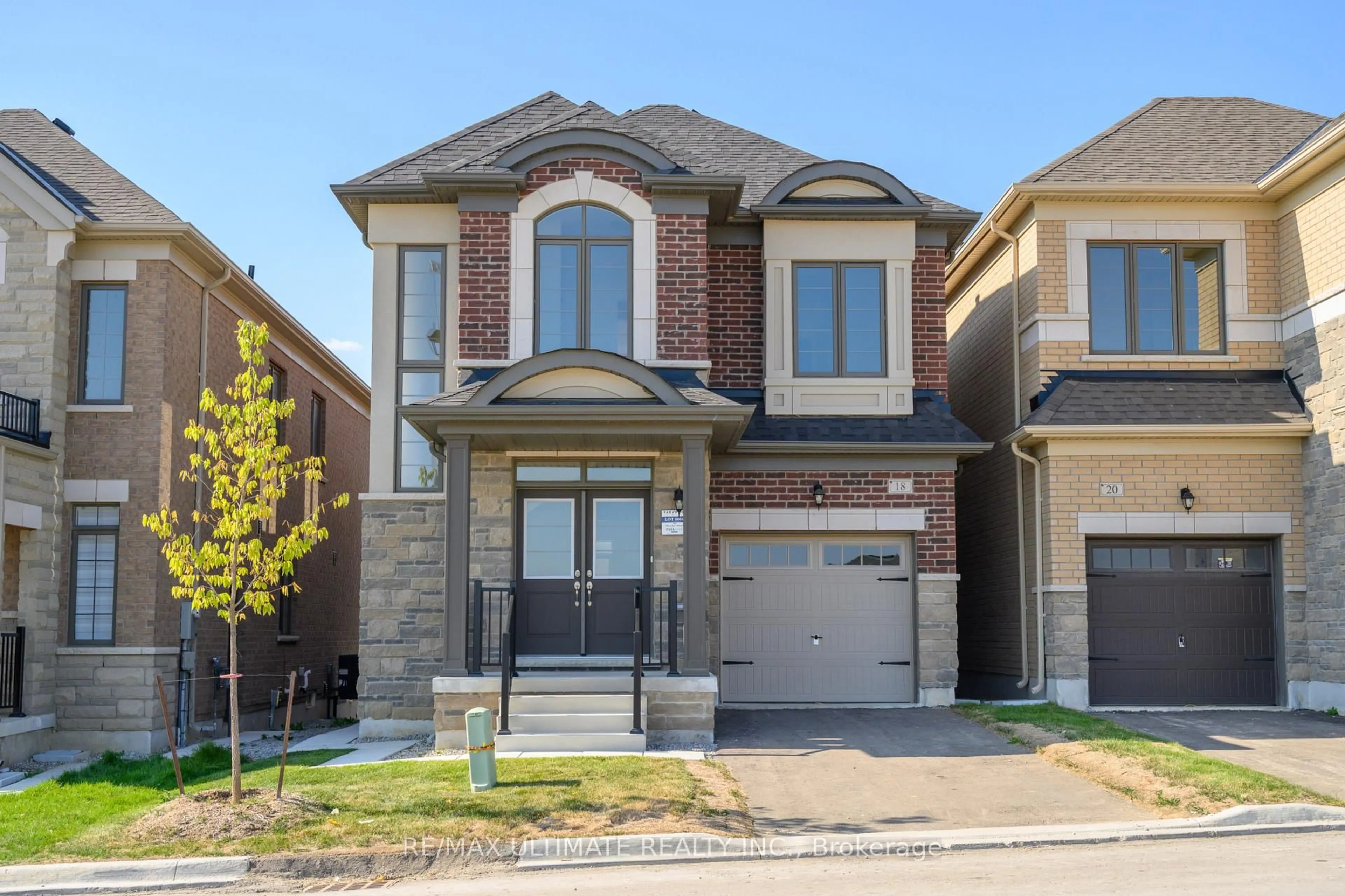 Home with brick exterior material, street for 18 Thresher St, Brampton Ontario L6Z 3N1