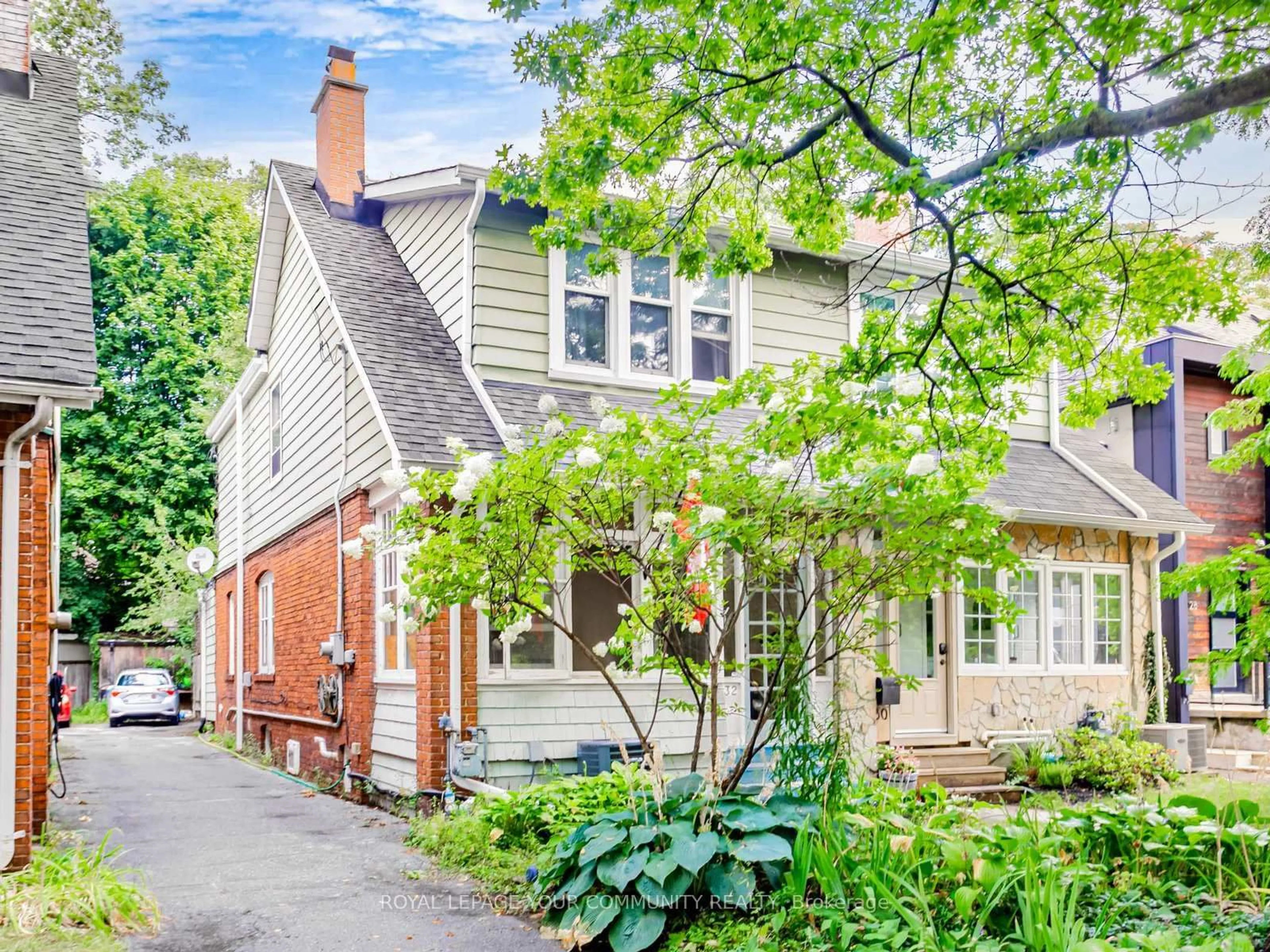 Home with brick exterior material, street for 32 Webb Ave, Toronto Ontario M6P 1M5
