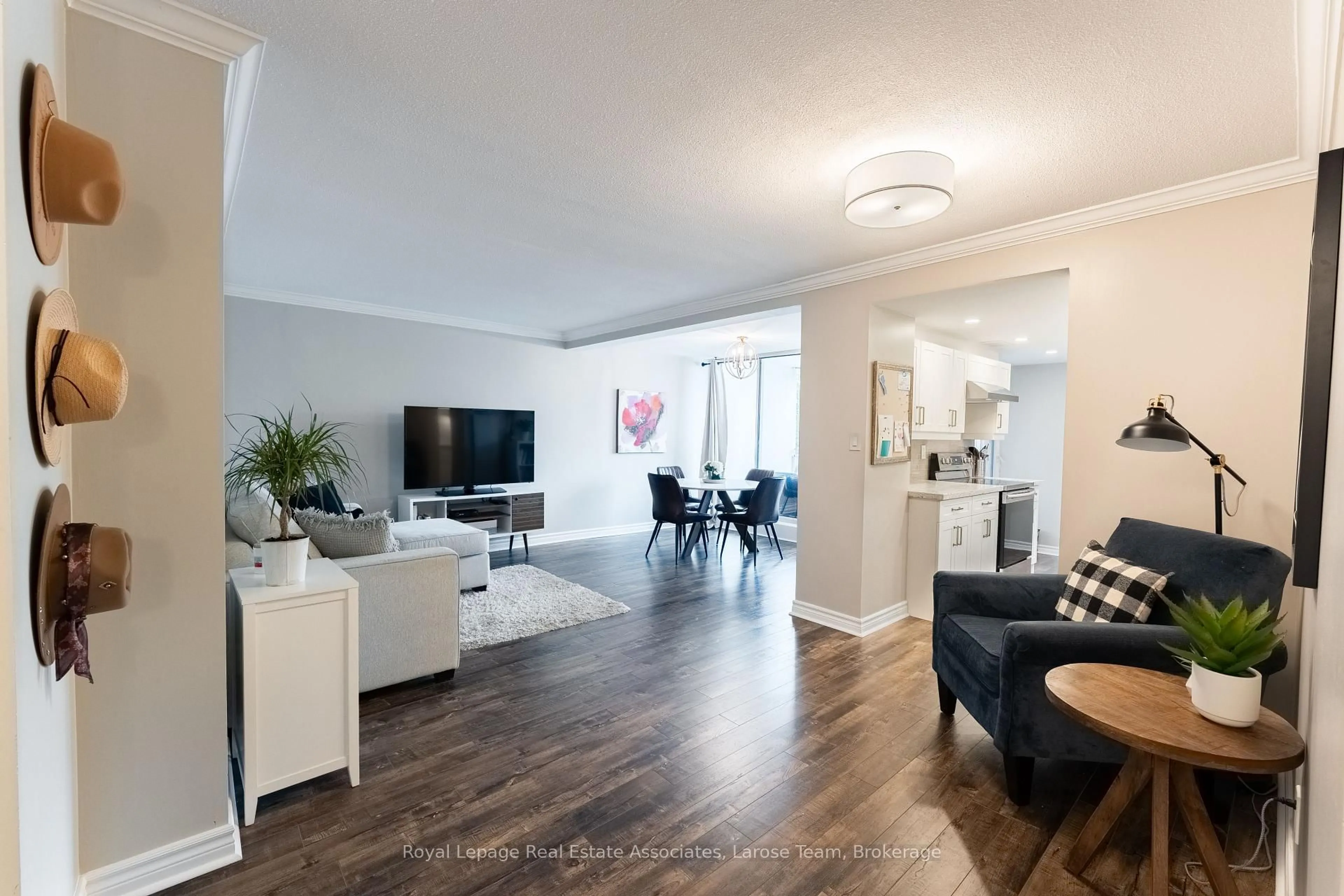 Living room with furniture, wood/laminate floor for 1425 Ghent Ave #201, Burlington Ontario L7S 1X5