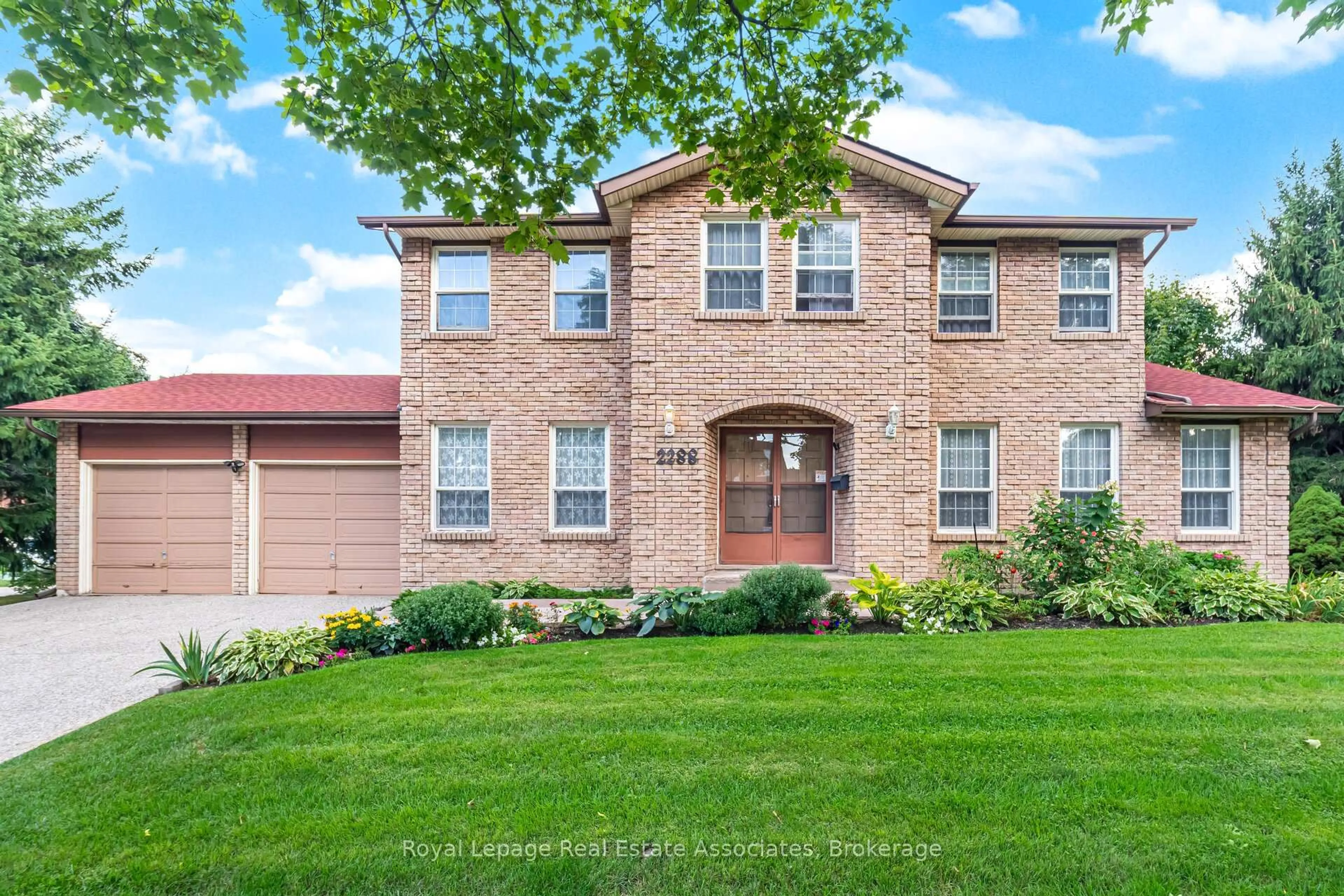 Home with brick exterior material, street for 2288 Log Wood Crt, Mississauga Ontario L5C 3C5