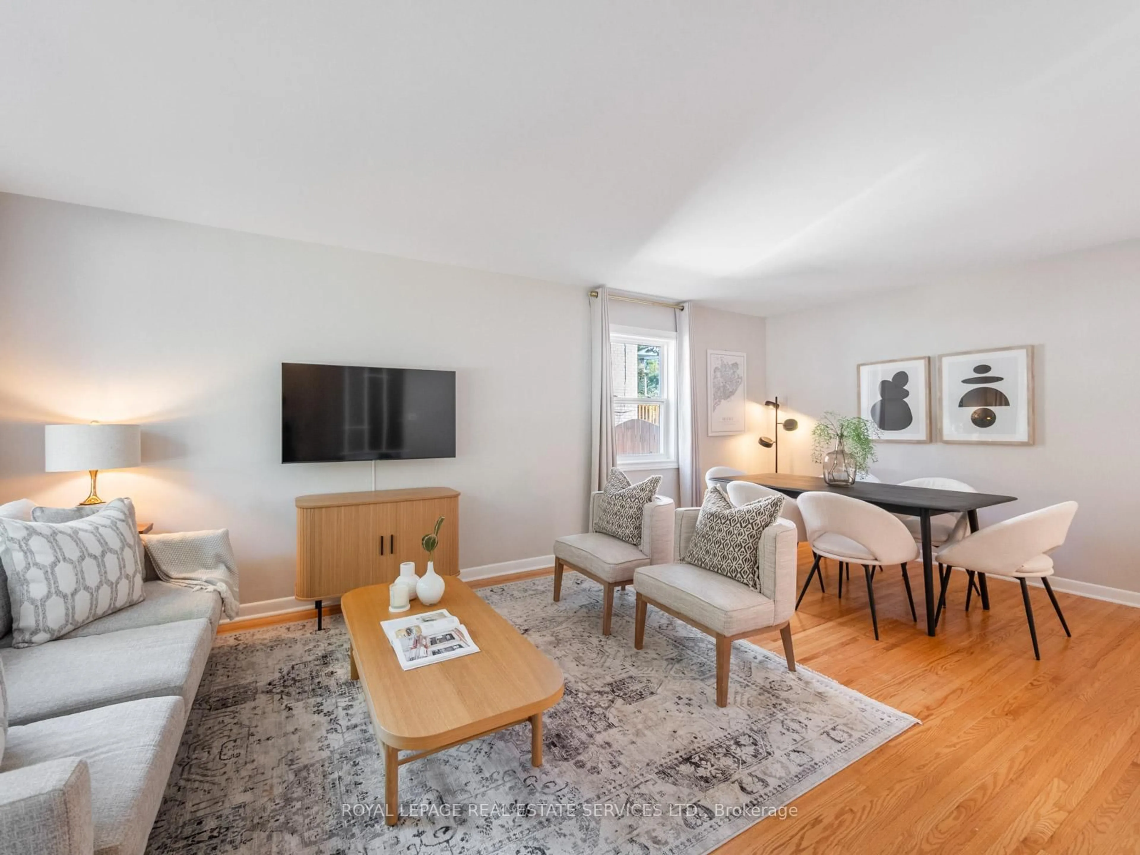 Living room with furniture, wood/laminate floor for 61 Skylark Rd, Toronto Ontario M6S 4M5