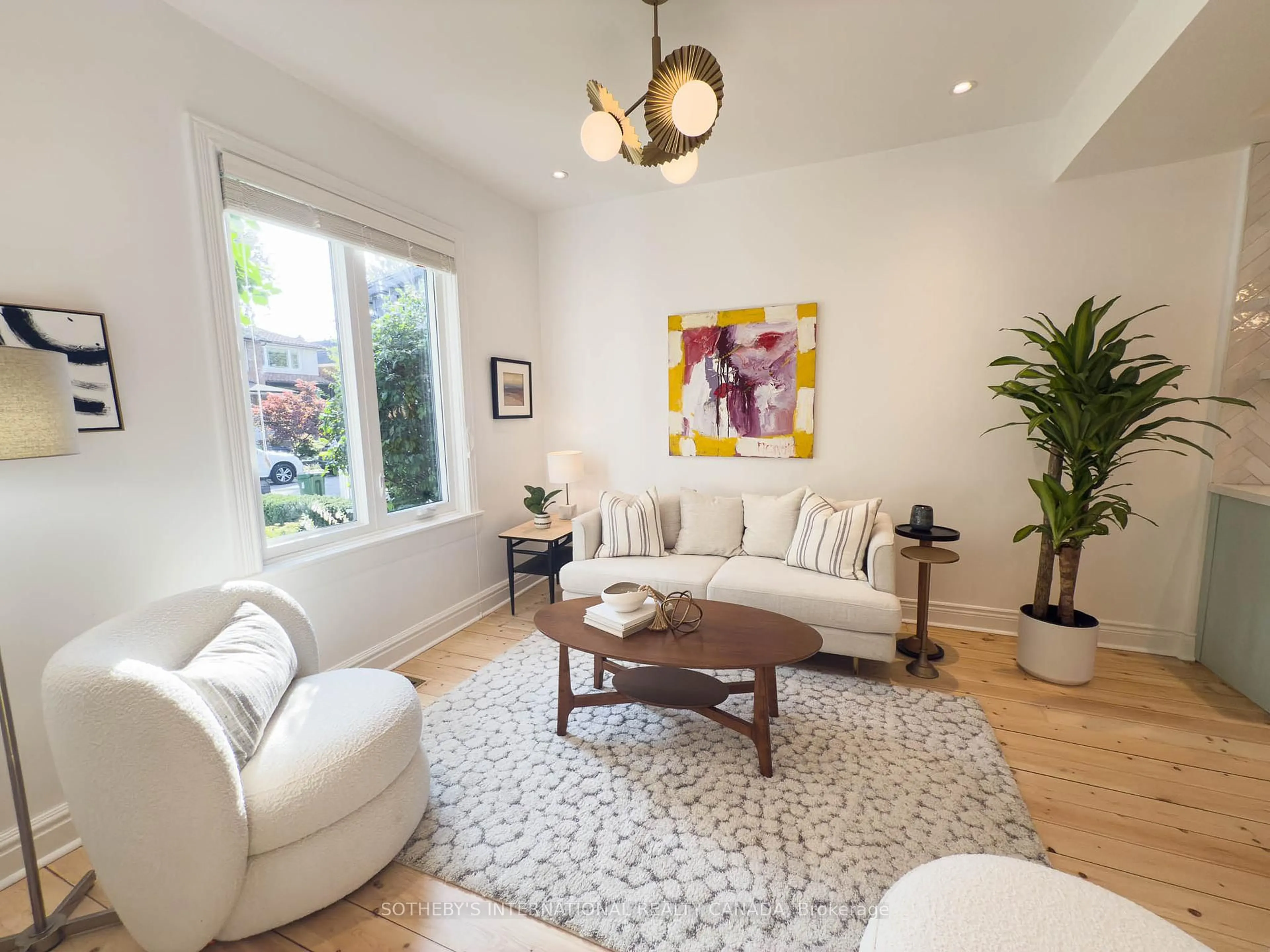 Living room with furniture, wood/laminate floor for 442 Salem Ave, Toronto Ontario M6H 3E1