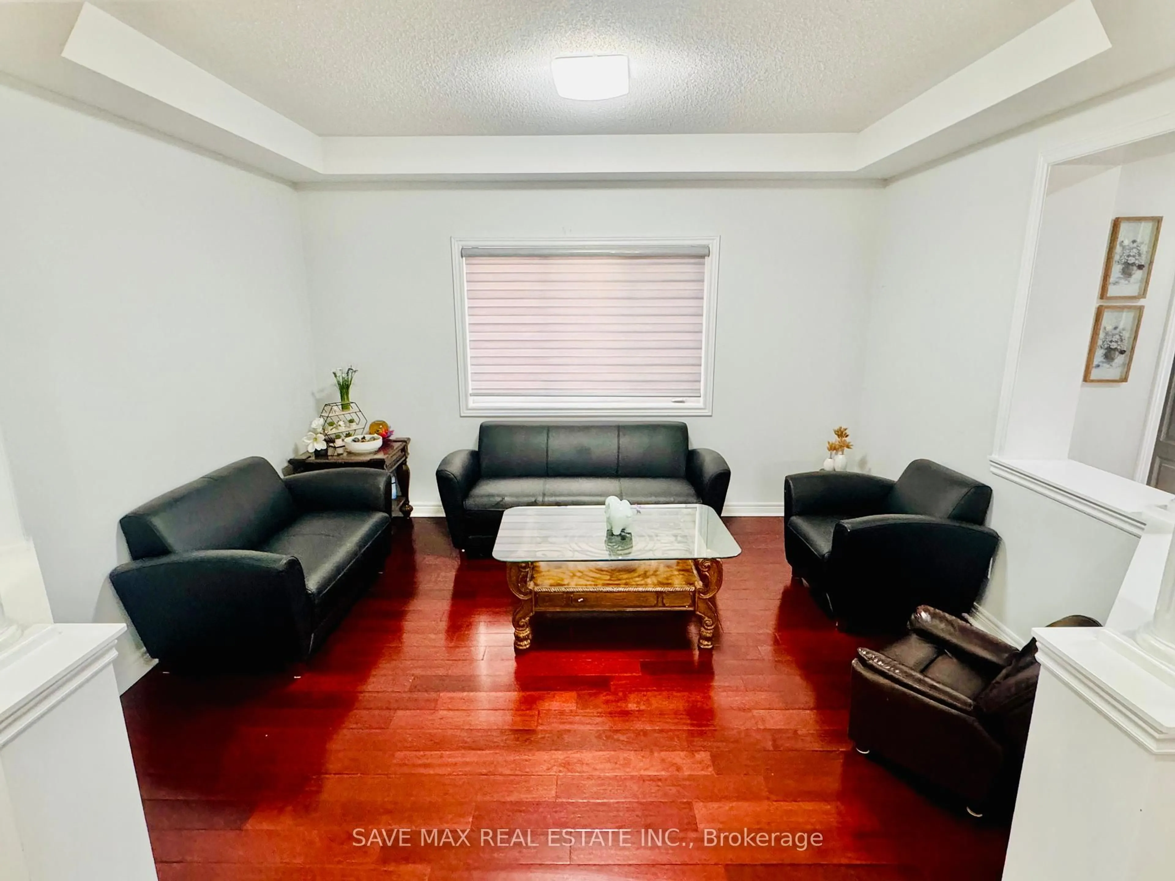 Living room with furniture, wood/laminate floor for 17 Charger Lane, Brampton Ontario L7A 3B2