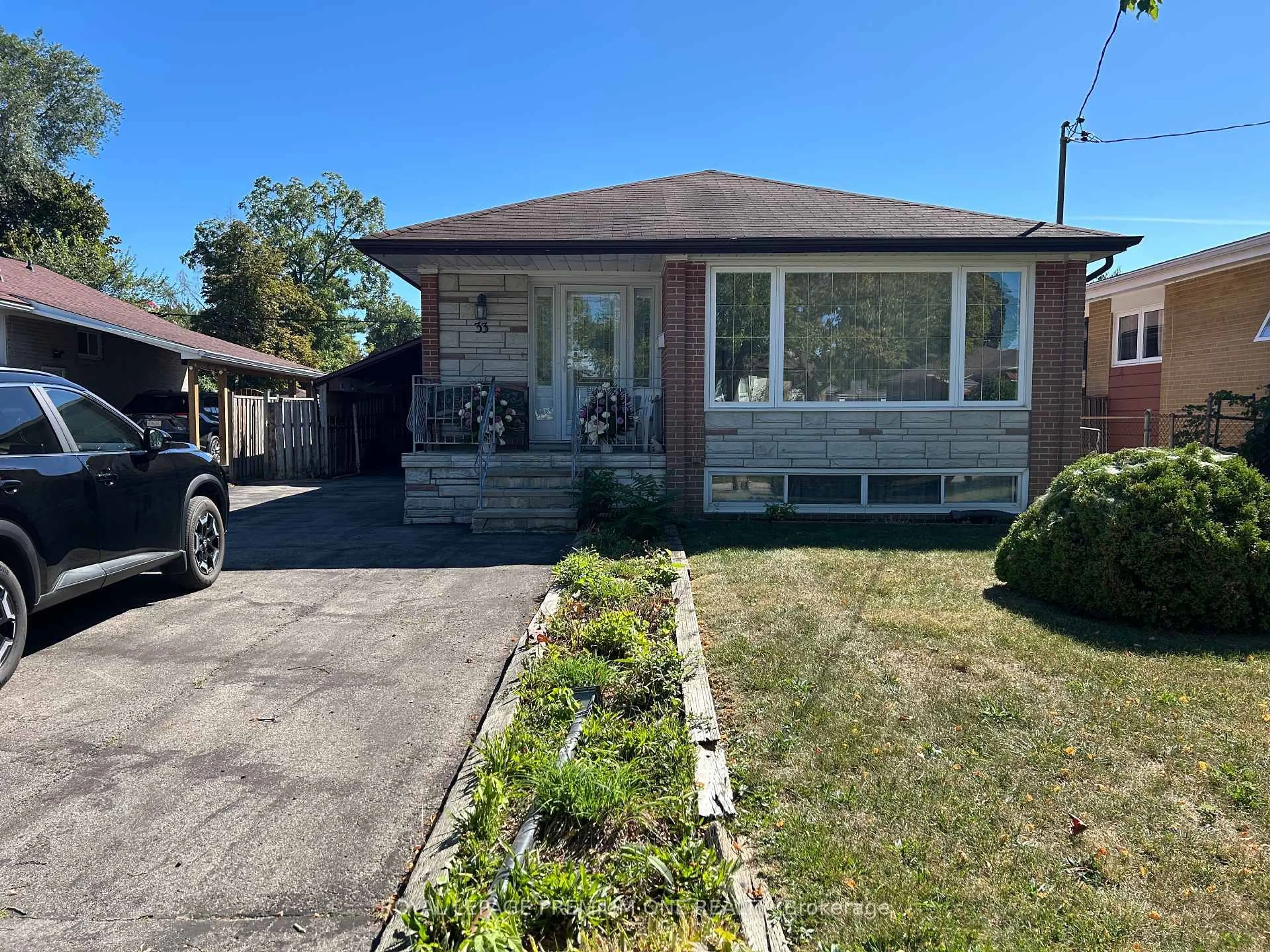 Home with brick exterior material, street for 33 Monterrey Dr, Toronto Ontario M9V 1S7