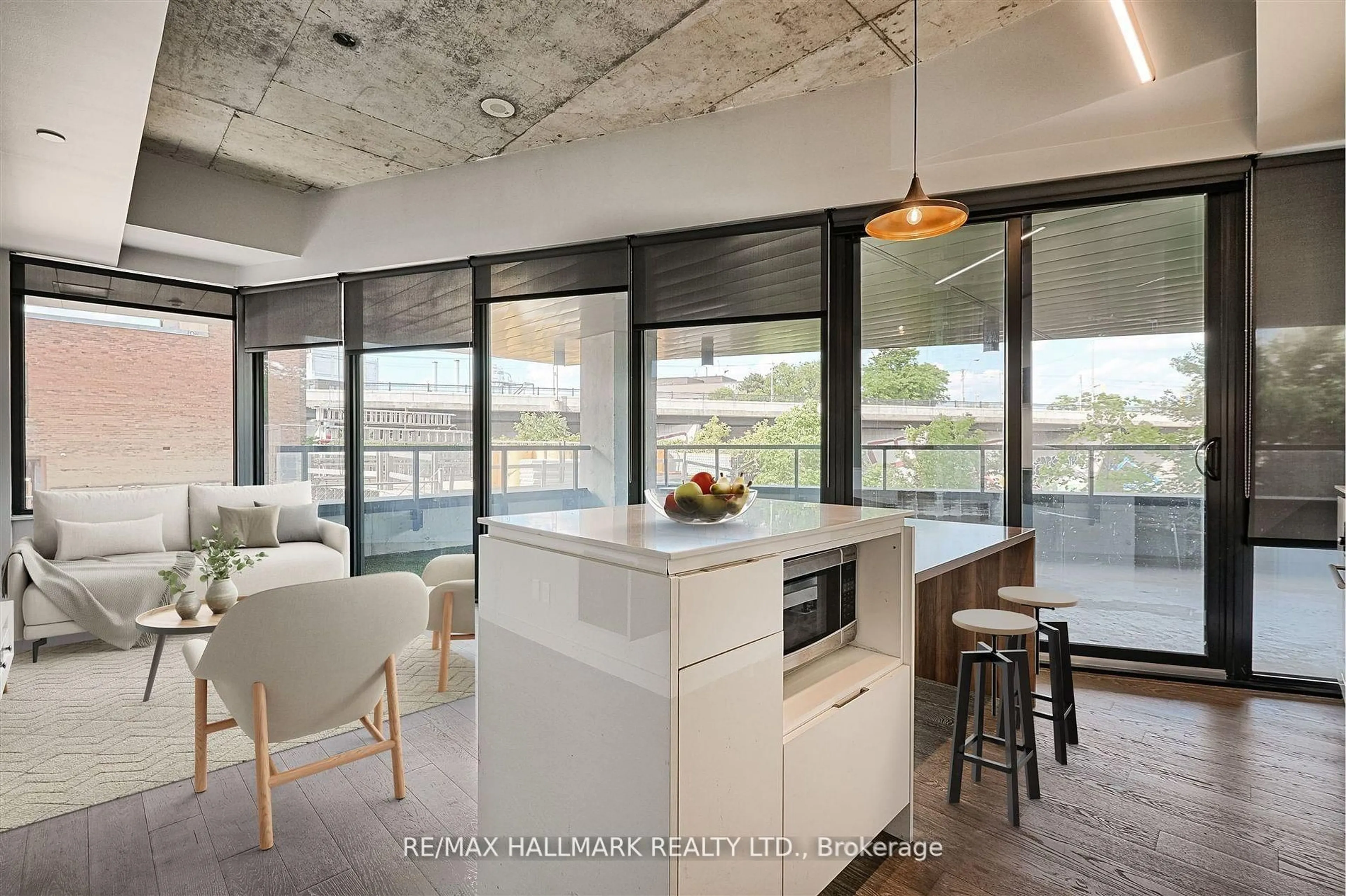 Open concept kitchen, cement floor for 383 Sorauren Ave #209, Toronto Ontario M6R 0A4