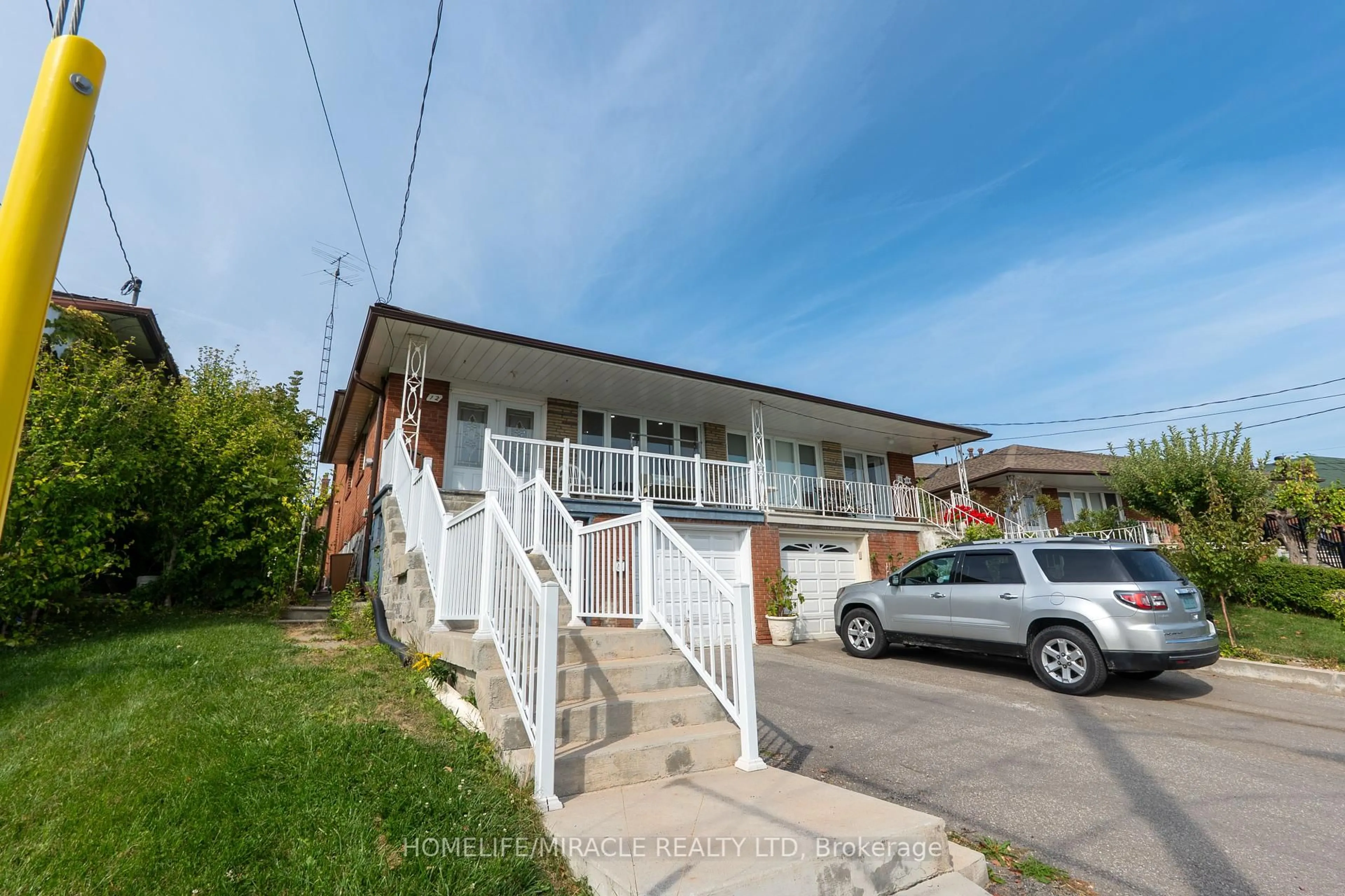A pic from outside/outdoor area/front of a property/back of a property/a pic from drone, street for 12 Brubeck Rd, Toronto Ontario M9M 1W7