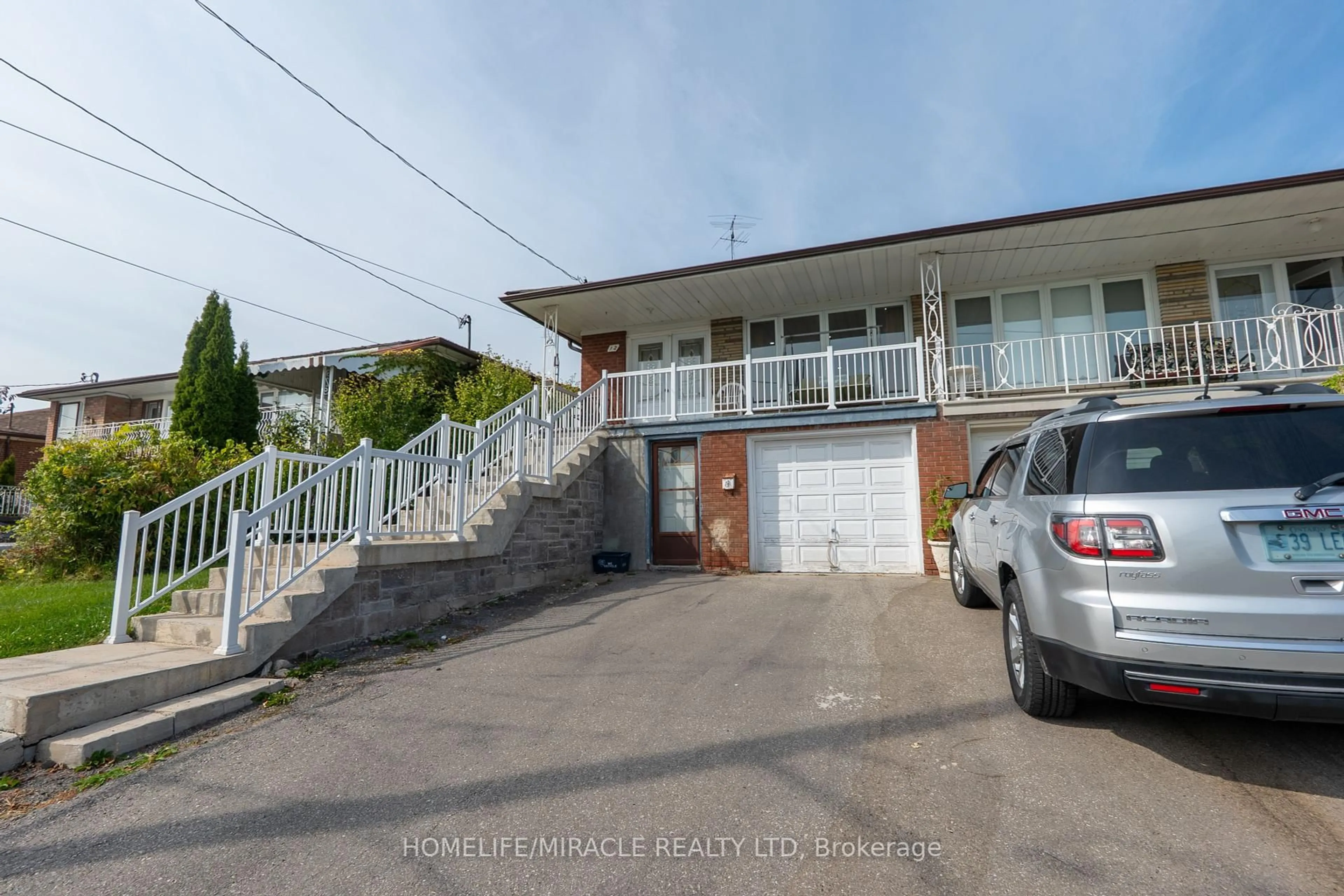 A pic from outside/outdoor area/front of a property/back of a property/a pic from drone, street for 12 Brubeck Rd, Toronto Ontario M9M 1W7