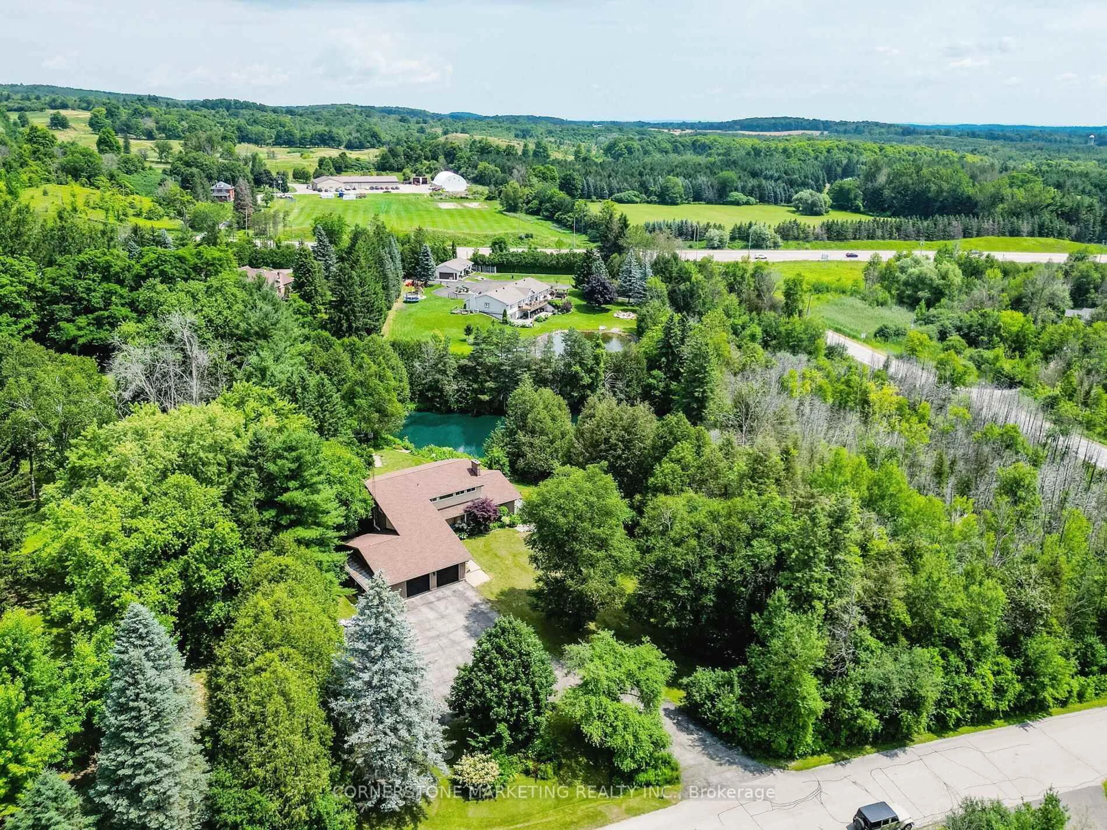 A pic from outside/outdoor area/front of a property/back of a property/a pic from drone, forest/trees view for 1 Cedar Dr, Caledon Ontario L7K 1H4