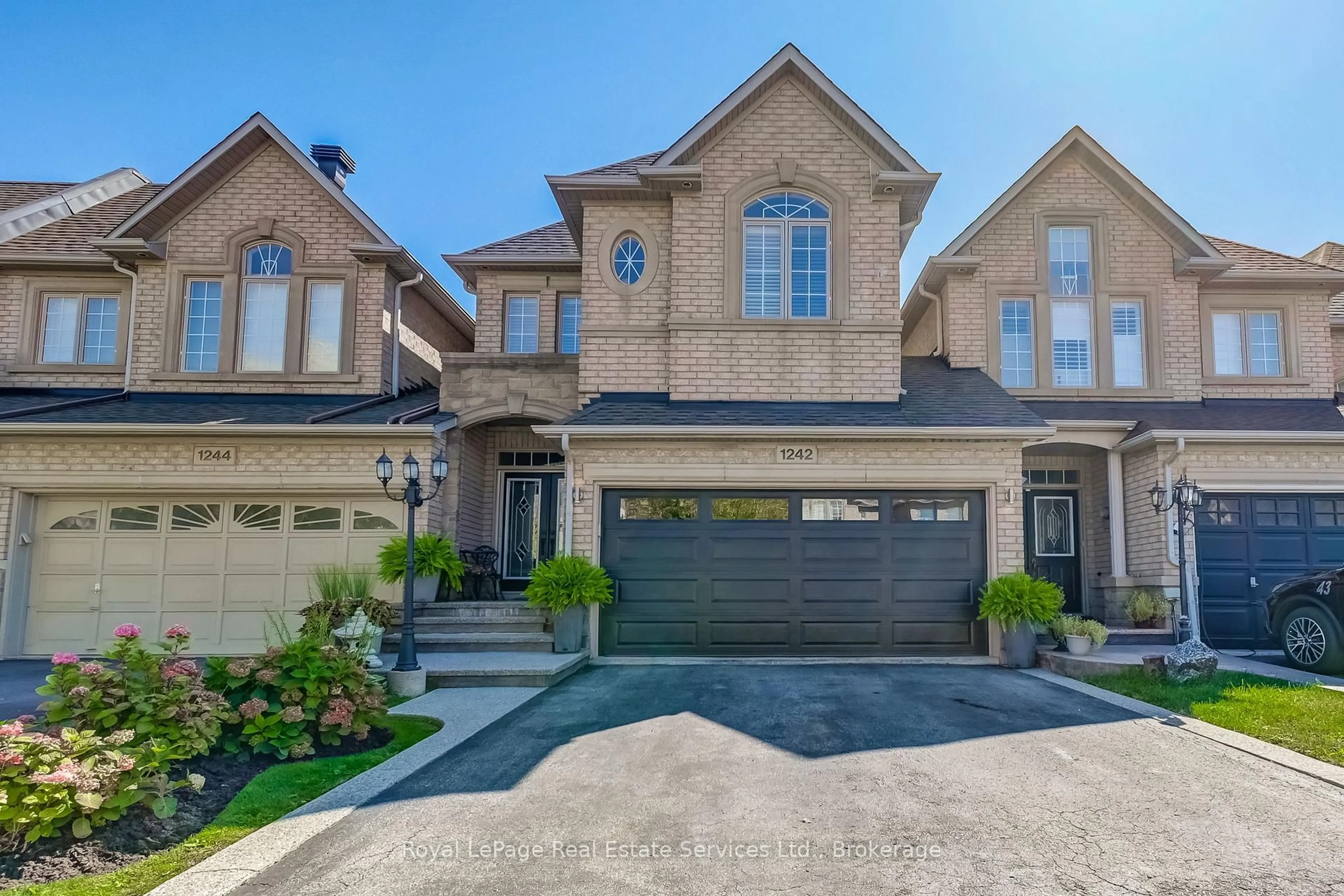 Home with brick exterior material, street for 1242 Agram Dr, Oakville Ontario L6H 7N9