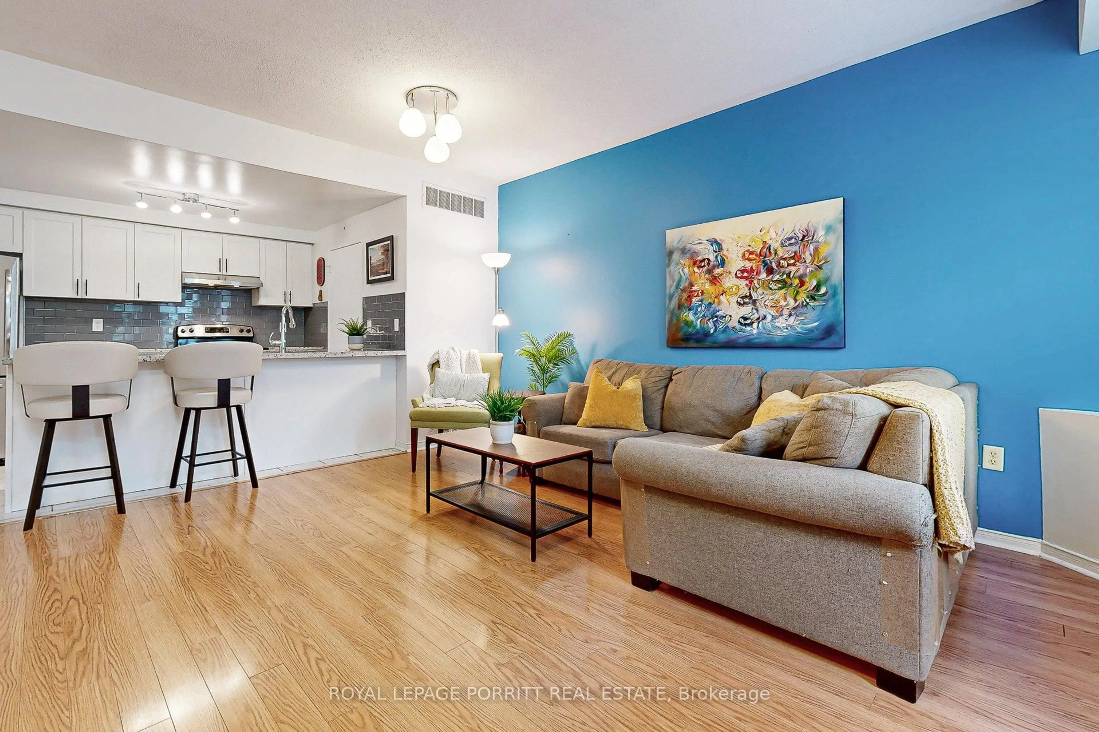 Living room with furniture, wood/laminate floor for 760 Lawrence Ave #174, Toronto Ontario M6A 3E7