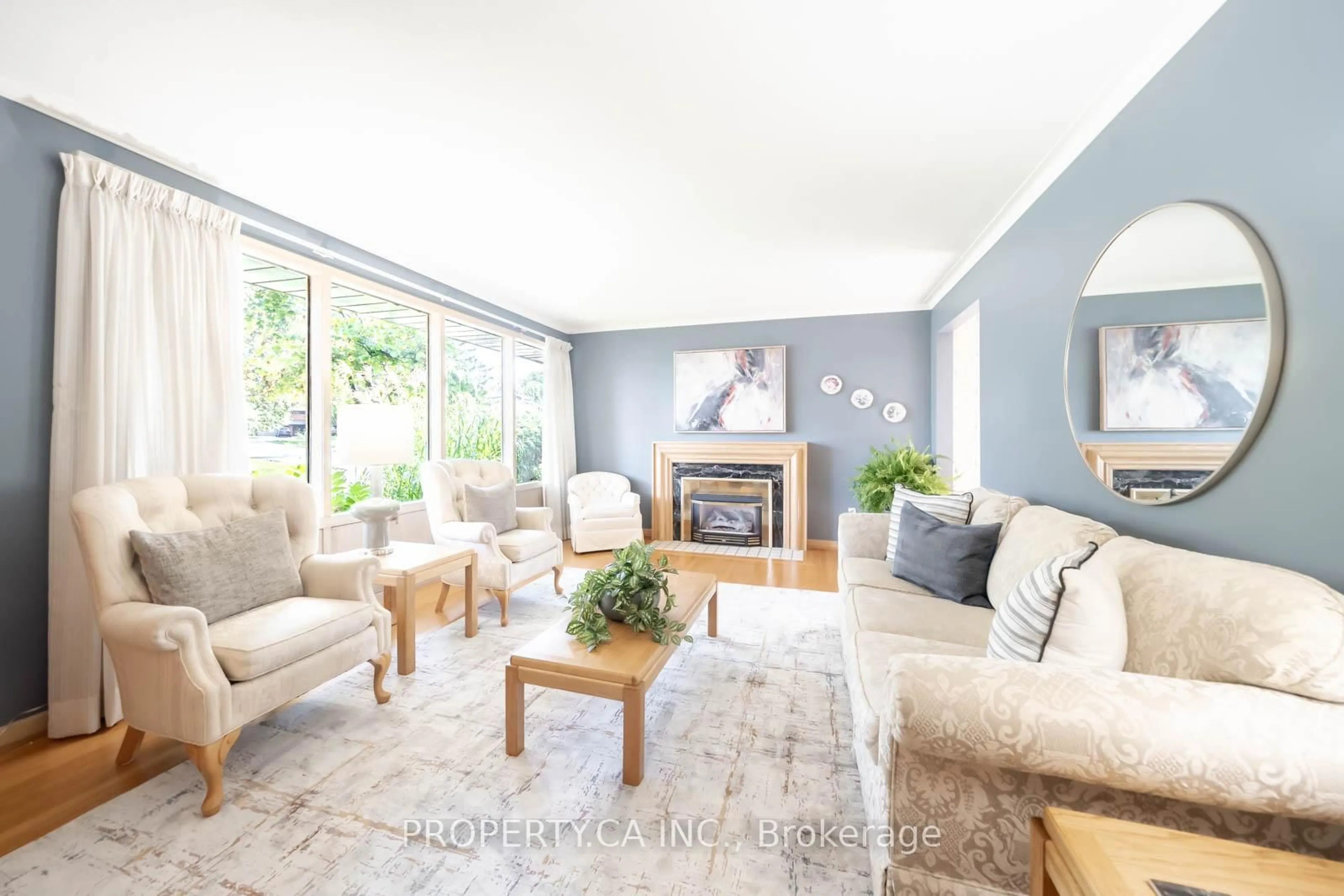 Living room with furniture, wood/laminate floor for 30 Bournemouth Rd, Toronto Ontario M9A 2C7