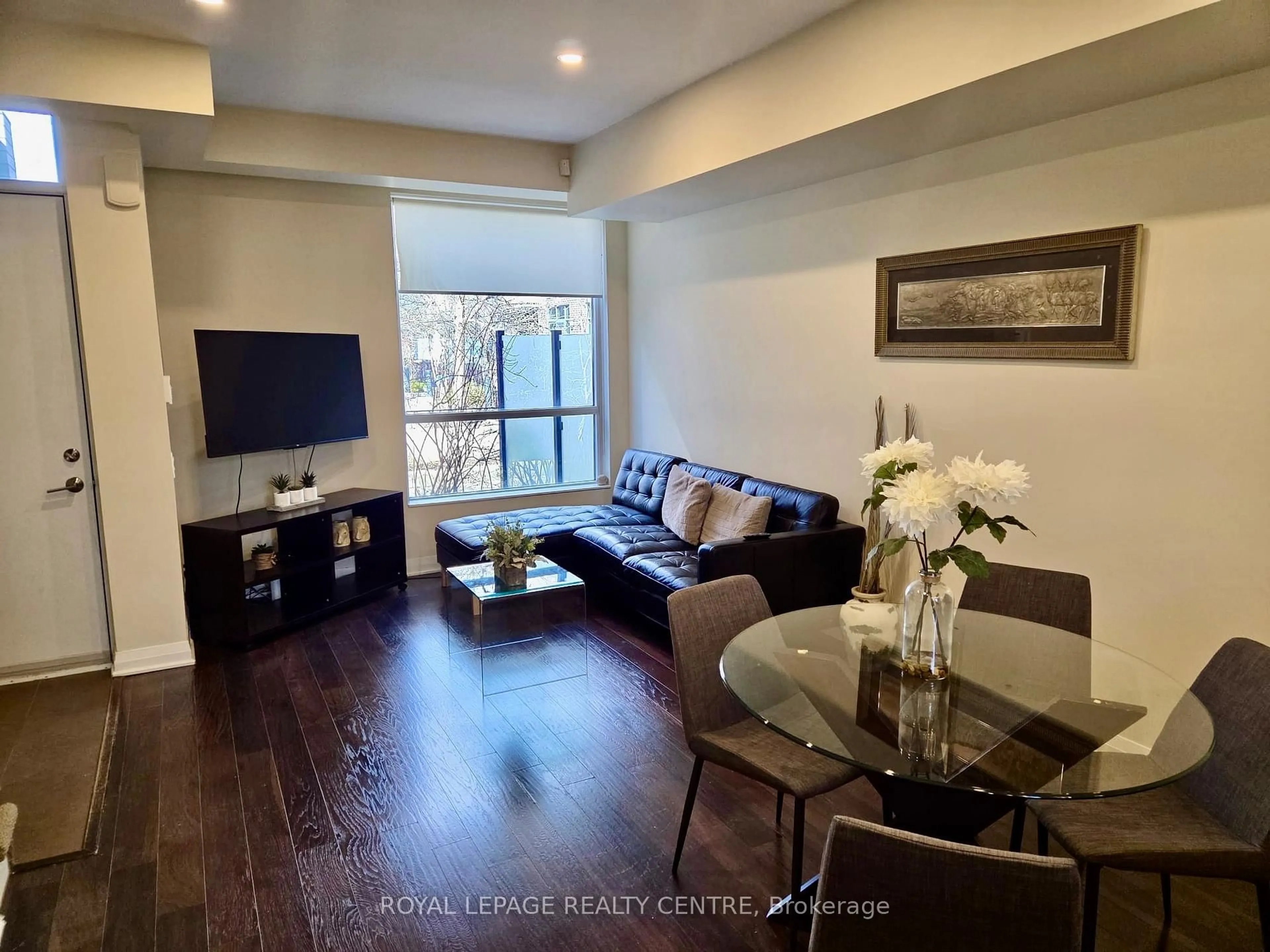 Living room with furniture, wood/laminate floor for 19 Valhalla Inn Rd #35, Toronto Ontario M9B 0B3