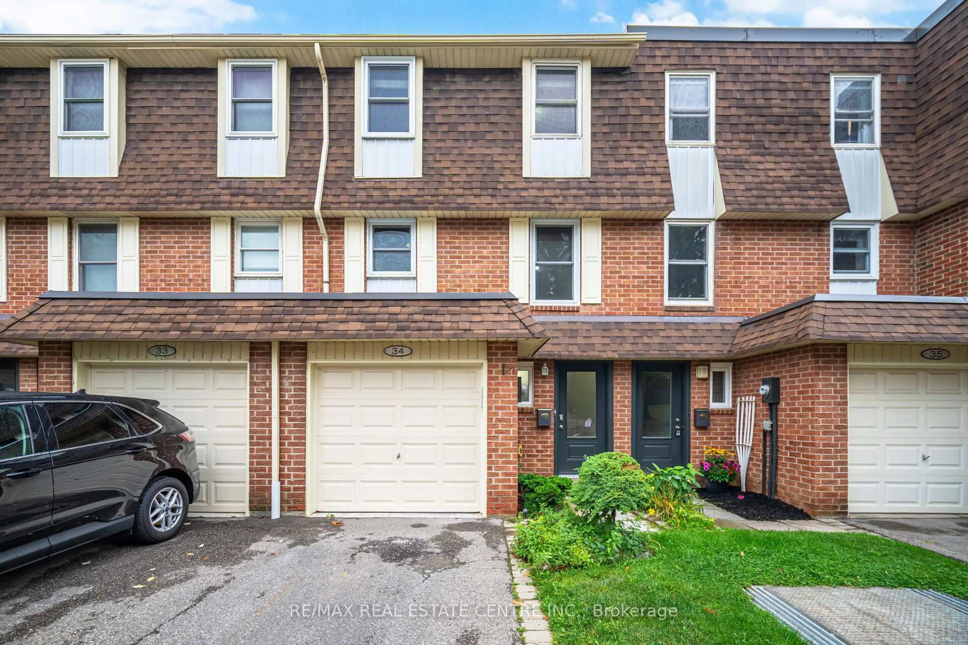 Home with brick exterior material, street for 30 Heslop Rd #34, Milton Ontario L9T 1B3