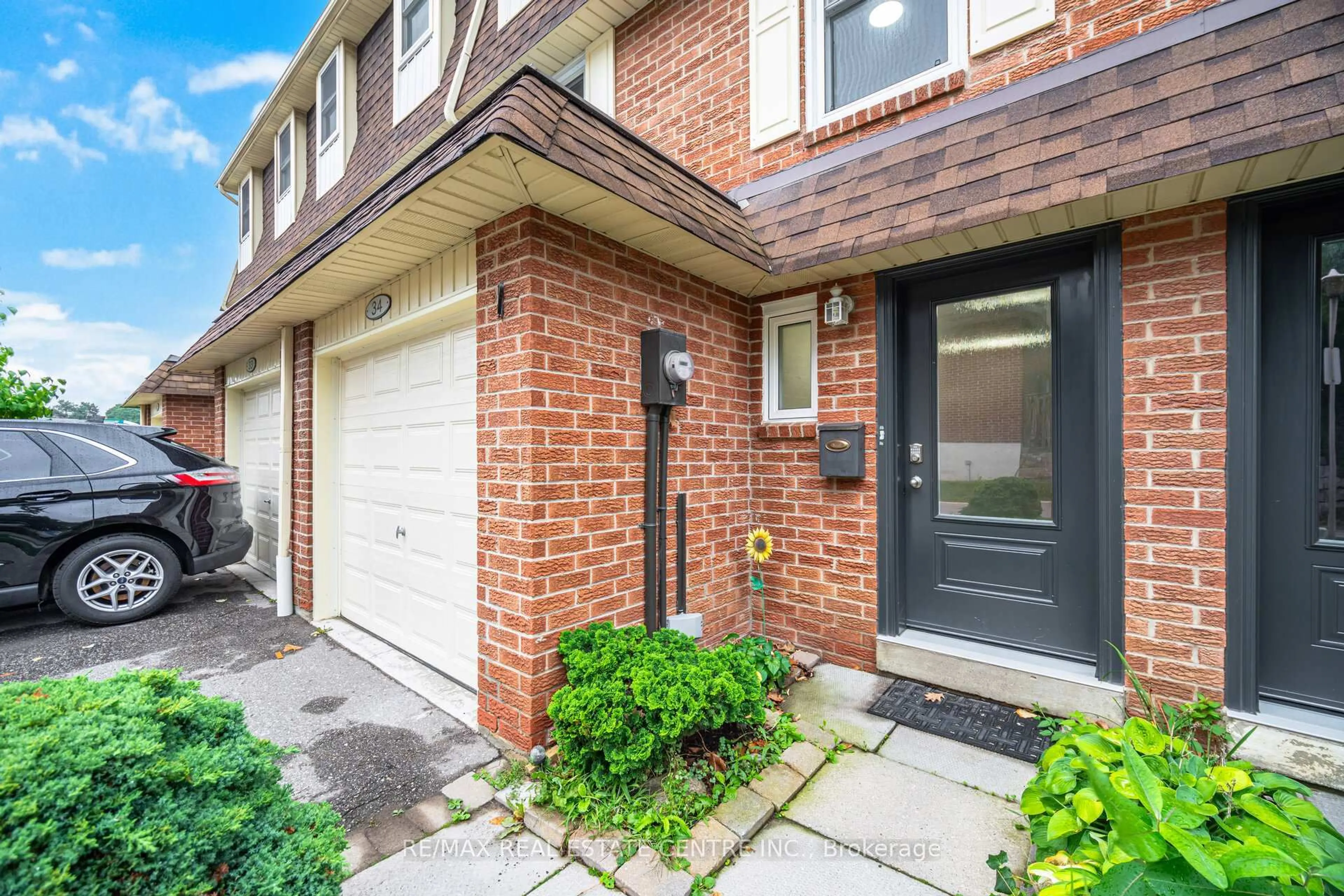 Home with brick exterior material, street for 30 Heslop Rd #34, Milton Ontario L9T 1B3