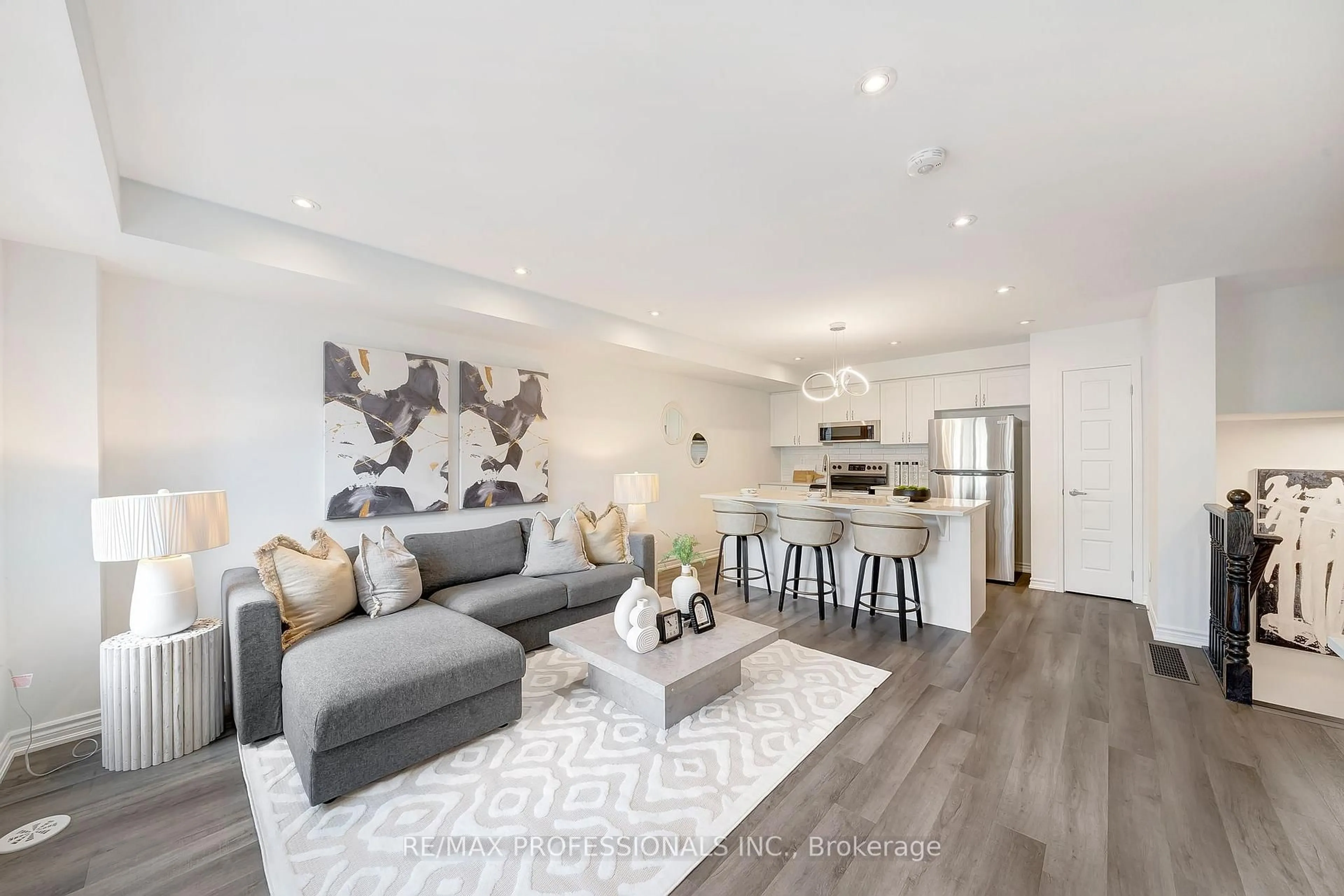 Living room with furniture, wood/laminate floor for 1272 Hop Pl, Milton Ontario L9E 1S4