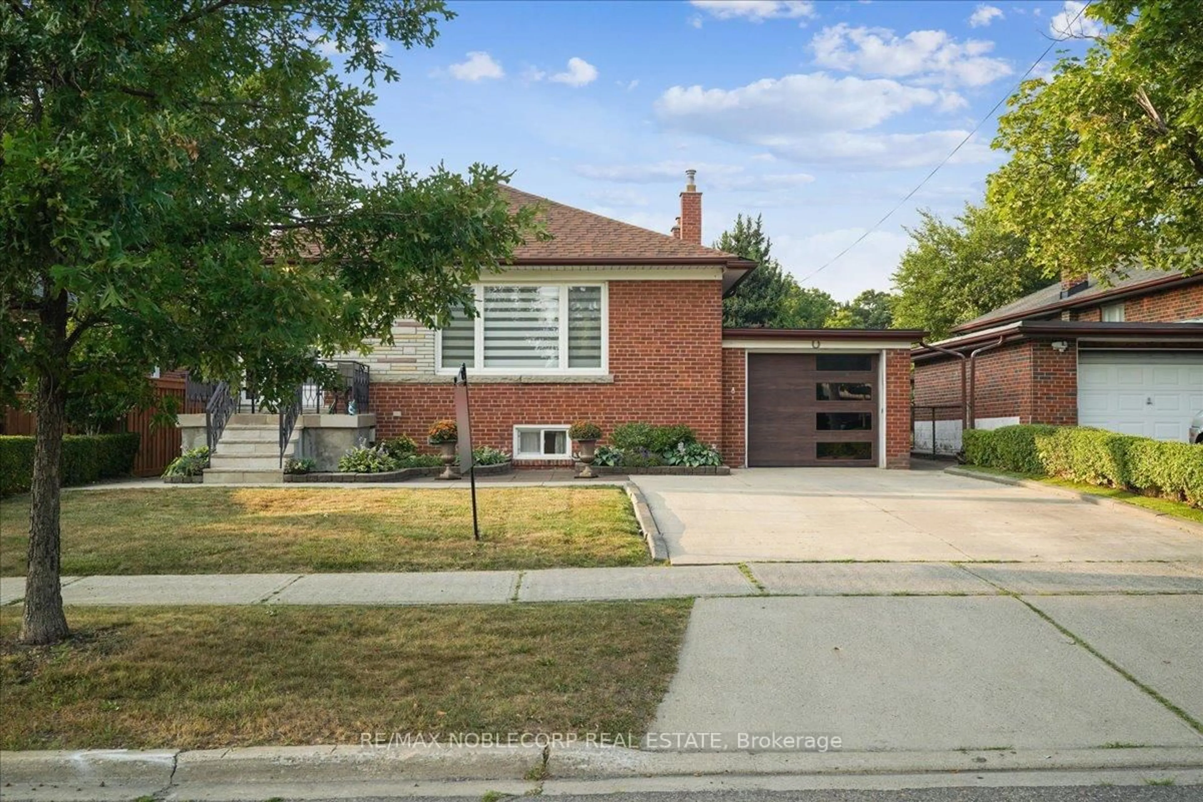 Home with brick exterior material, street for 65 Exbury Rd, Toronto Ontario M3M 1P9