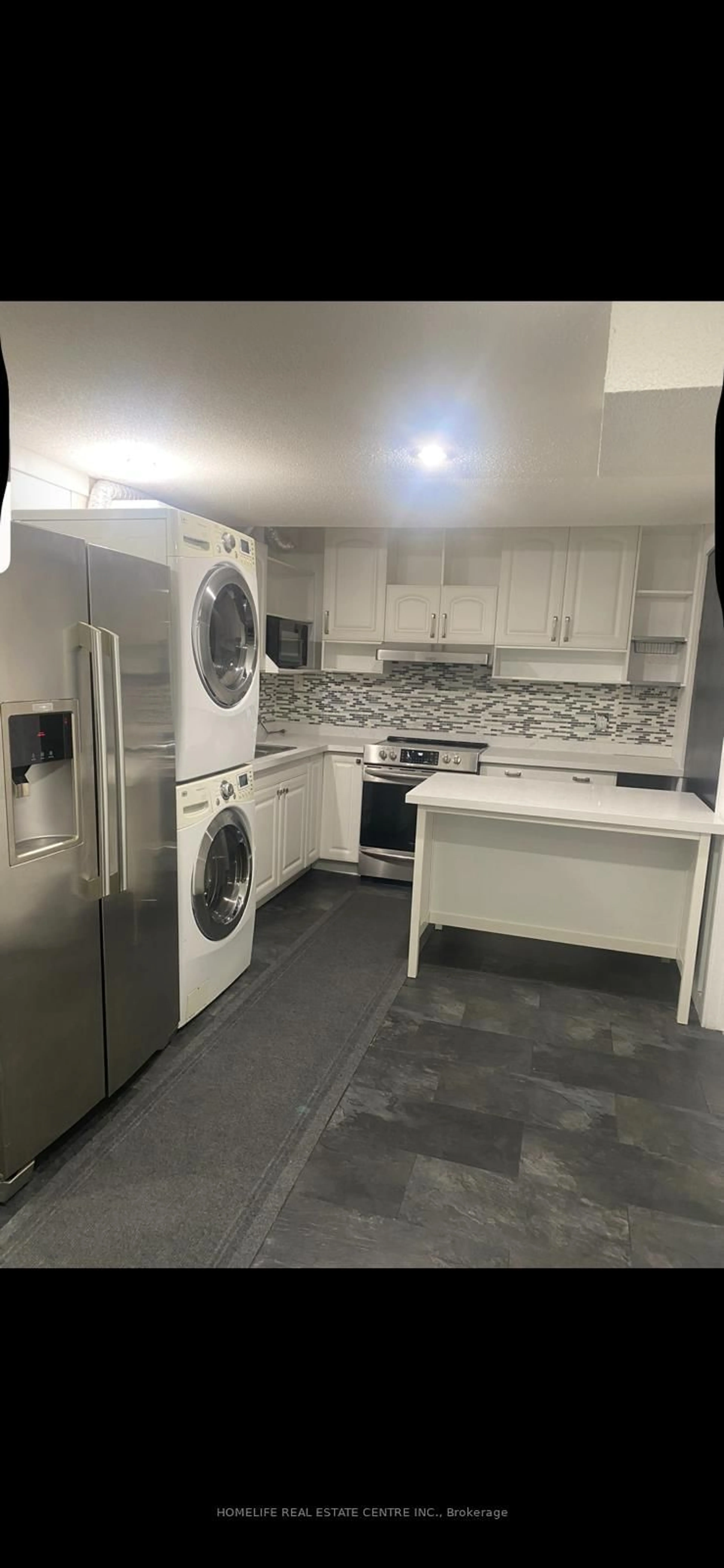 Kitchen with laundary machines, unknown for 38 Dunvegan Cres, Brampton Ontario L7A 2Y2