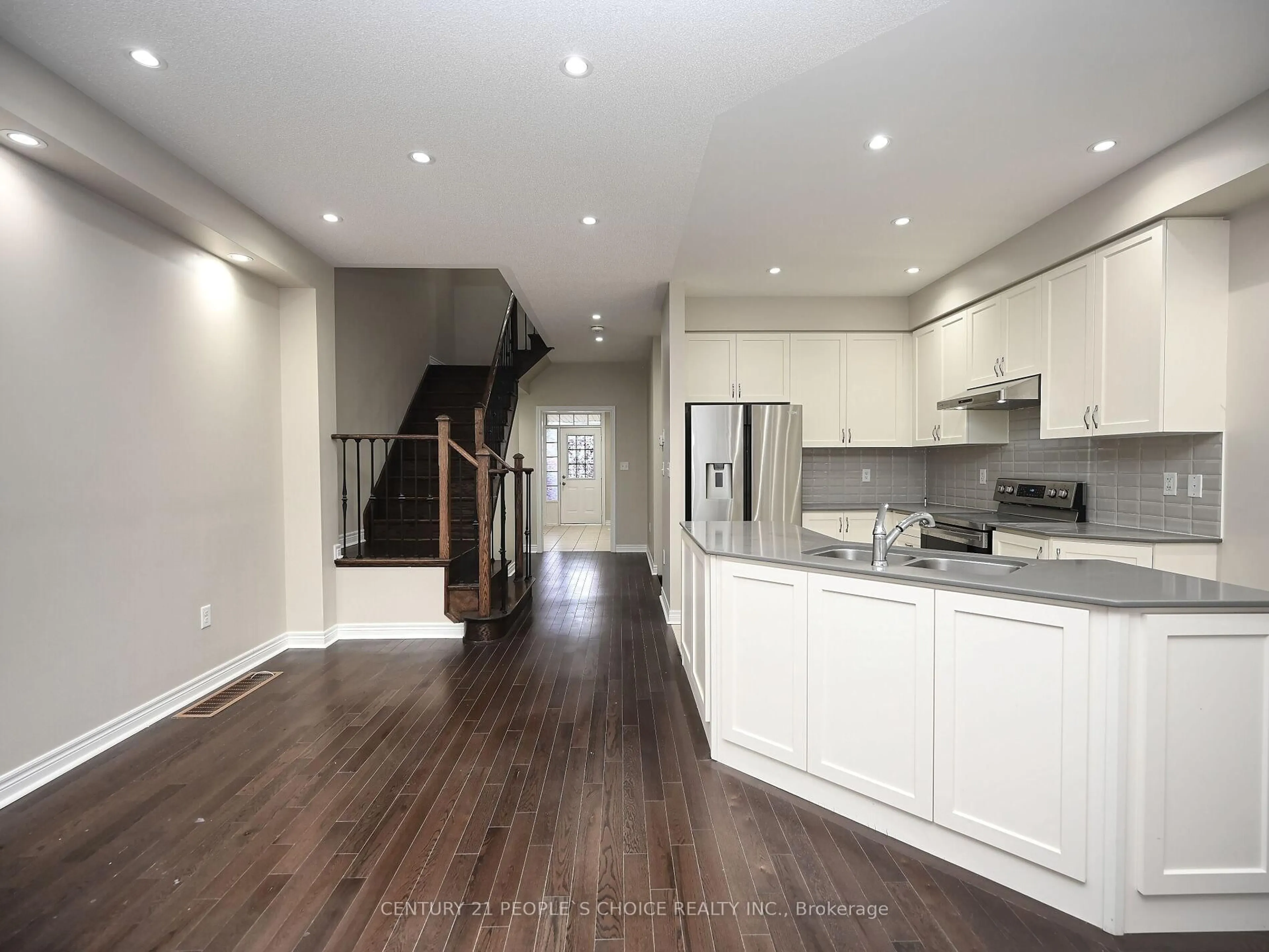Open concept kitchen, wood/laminate floor for 39 Pearman Cres, Brampton Ontario L7A 4Y8