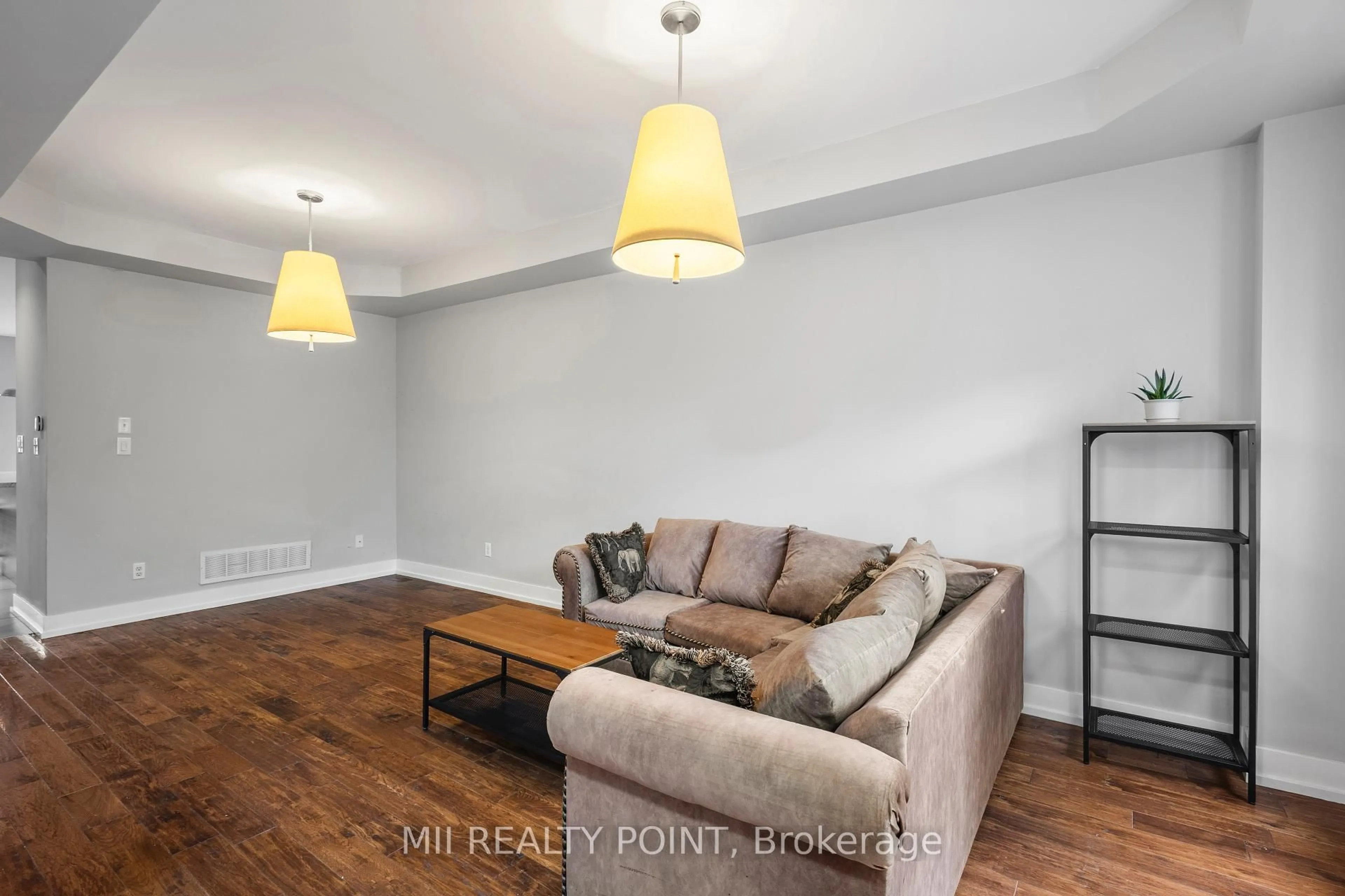 Living room with furniture, wood/laminate floor for 24 Bowsfield Rd, Toronto Ontario M3J 3R3
